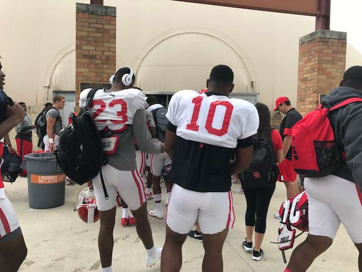The University of Houston football team practiced Monday at the University of Texas' facilities in Austin after being displaced by Hurricane Harvey.