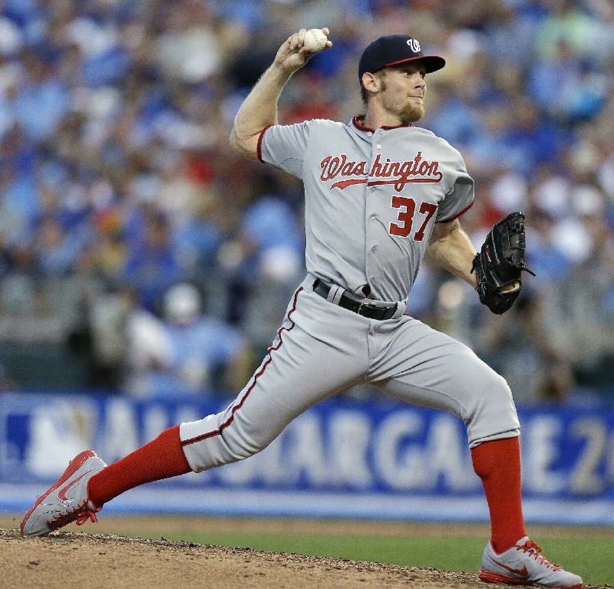 ASSOCIATED PRESS National League's Stephen Strasburg, of the Washington Nationals, delivers during the fifth inning of the MLB All-Star Game Tuesday in Kansas City, Mo. The Nationals may end up with a Strasburg dilemma if they stay in the race for the NL East title. The Nationals, who are in first place, have said they will shut Strasburg down before the end of the season.