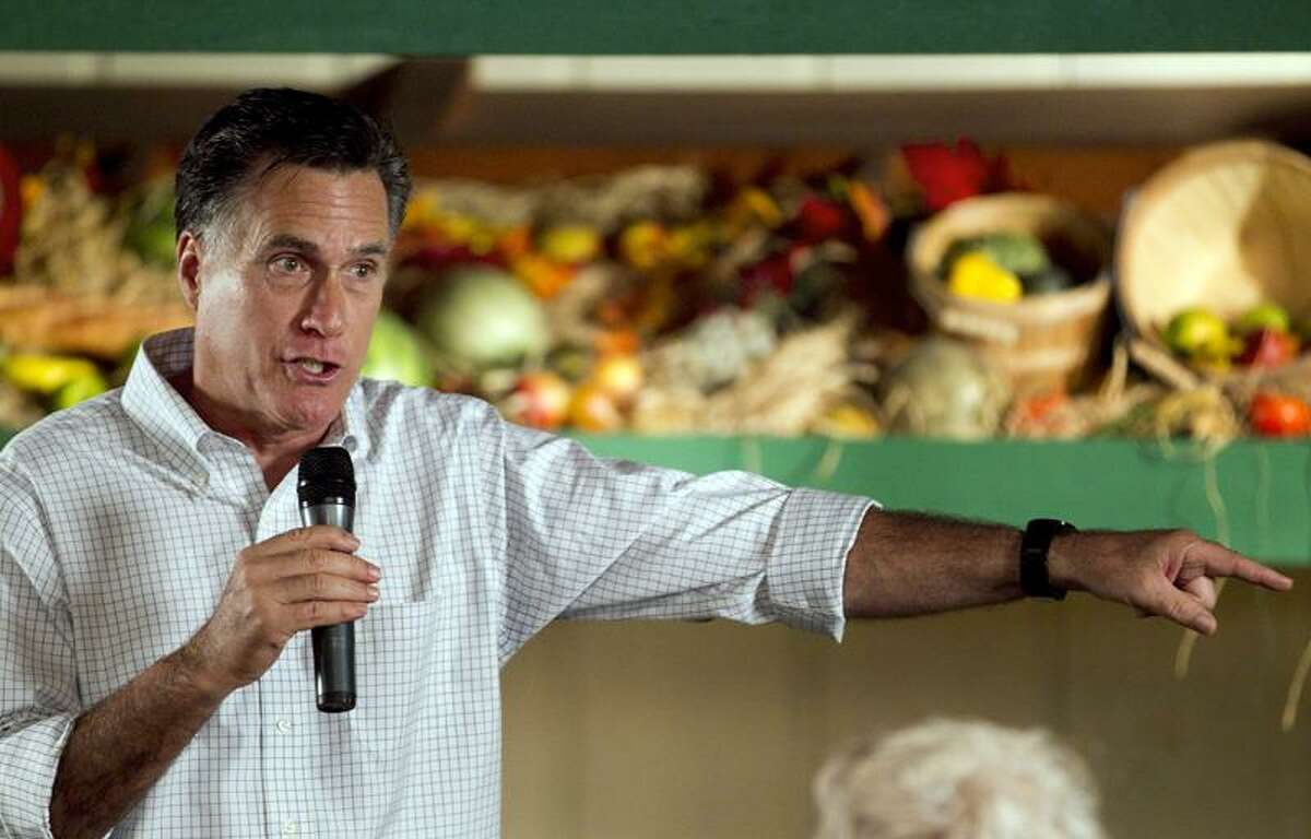 Republican presidential candidate former Massachusetts Gov. Mitt Romney addresses an audience during a campaign stop at a restaurant in Rockford, Ill., Sunday, March 18, 2012. (AP Photo/Steven Senne)