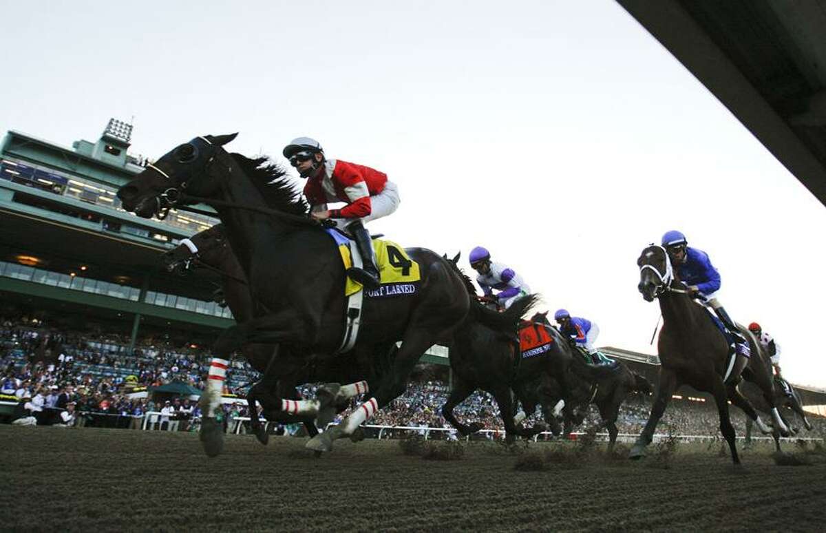 Brian Hernandez atop Fort Larned (4), leads the pack early during the running of the Breeders' Cup Classic horse race, Saturday, Nov. 3, 2012, at Santa Anita Park in Arcadia, Calif. (AP Photo/Mark J. Terrill)