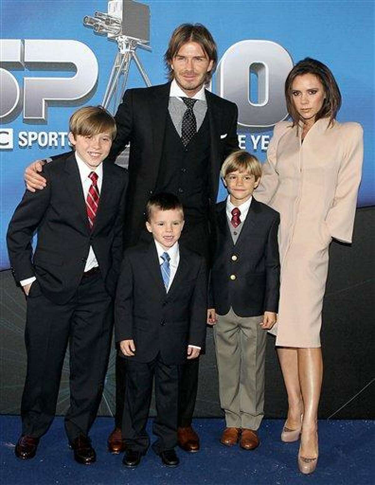 FILE- In this file photo dated Dec. 19 2010 showing the Beckham family, with David and Victoria Beckham, and their sons, from left to right, Brooklyn, Cruz and Romeo. Spokesman for David Beckham, Simon Oliveire says Sunday July 10, 2011, that Victoria Beckham has given birth to a healthy baby girl, at a hospital in Los Angeles, U.S. adding to their family of three boys. (AP Photo / David Davies, PA)
