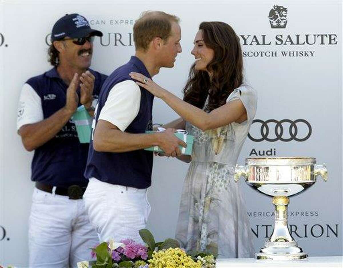 Kate, the Duchess of Cambridge congratulates her husband Prince William, Duke of Cambridge at the trophy ceremony after his team won the charity polo match at The Santa Barbara Polo & Racquet club on Saturday in Carpinteria Calif. The event was held in support of The American Friends of The Foundation of Prince William and Prince Harry.