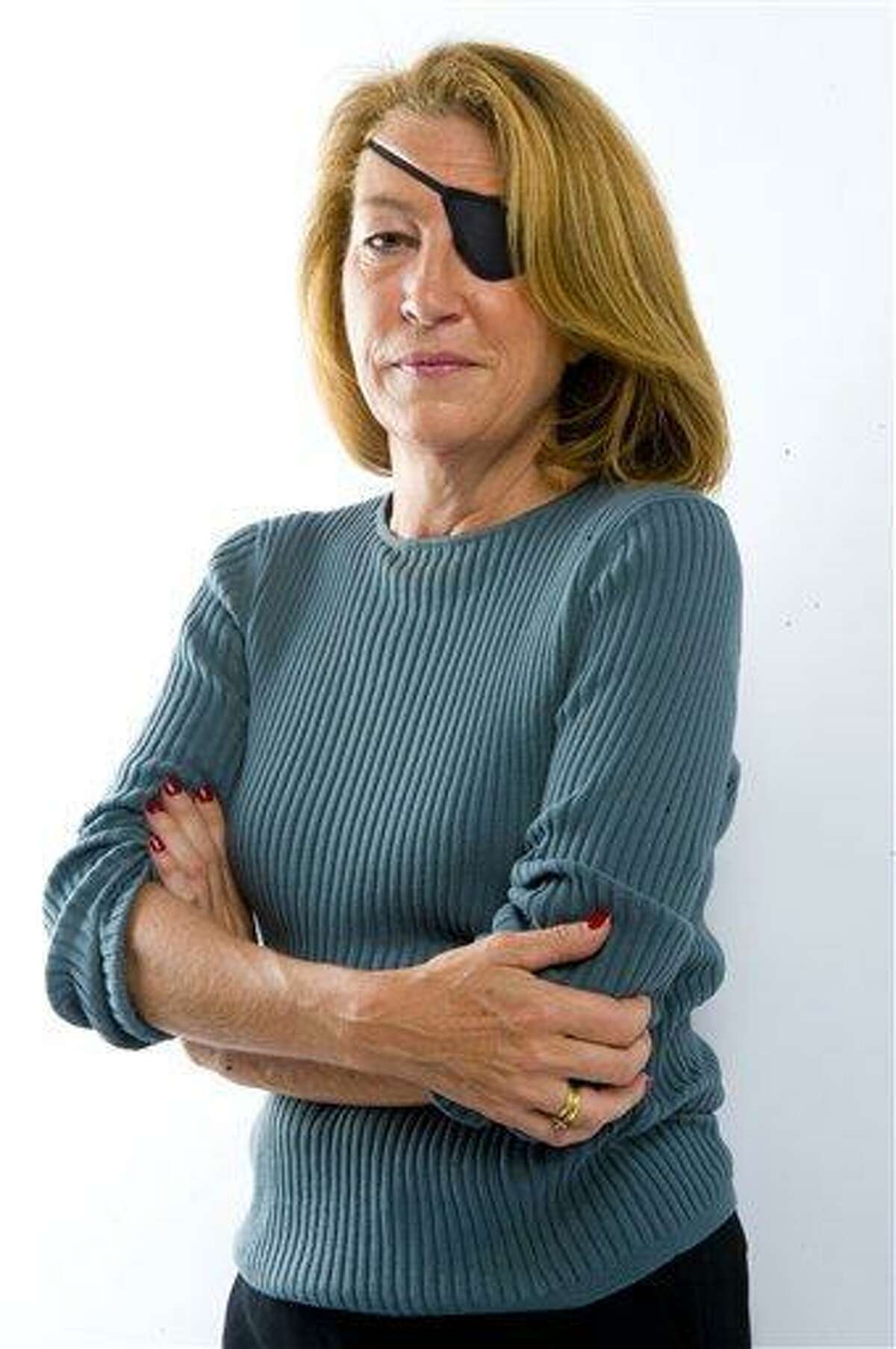 This is an undated image made available Wednesday by the Sunday Times in London of journalist Marie Colvin. A French government spokeswoman on Wednesday identified two Western reporters killed in Syria as American war reporter Marie Colvin and French photojournalist Remi Ochlik. Colvin, from Oyster Bay, New York, had been a foreign correspondent for Britain's Sunday Times for two decades, reporting from the world's most dangerous places. She lost the sight in one eye in Sri Lanka in 2001 but did not let that deter her. Associated Press