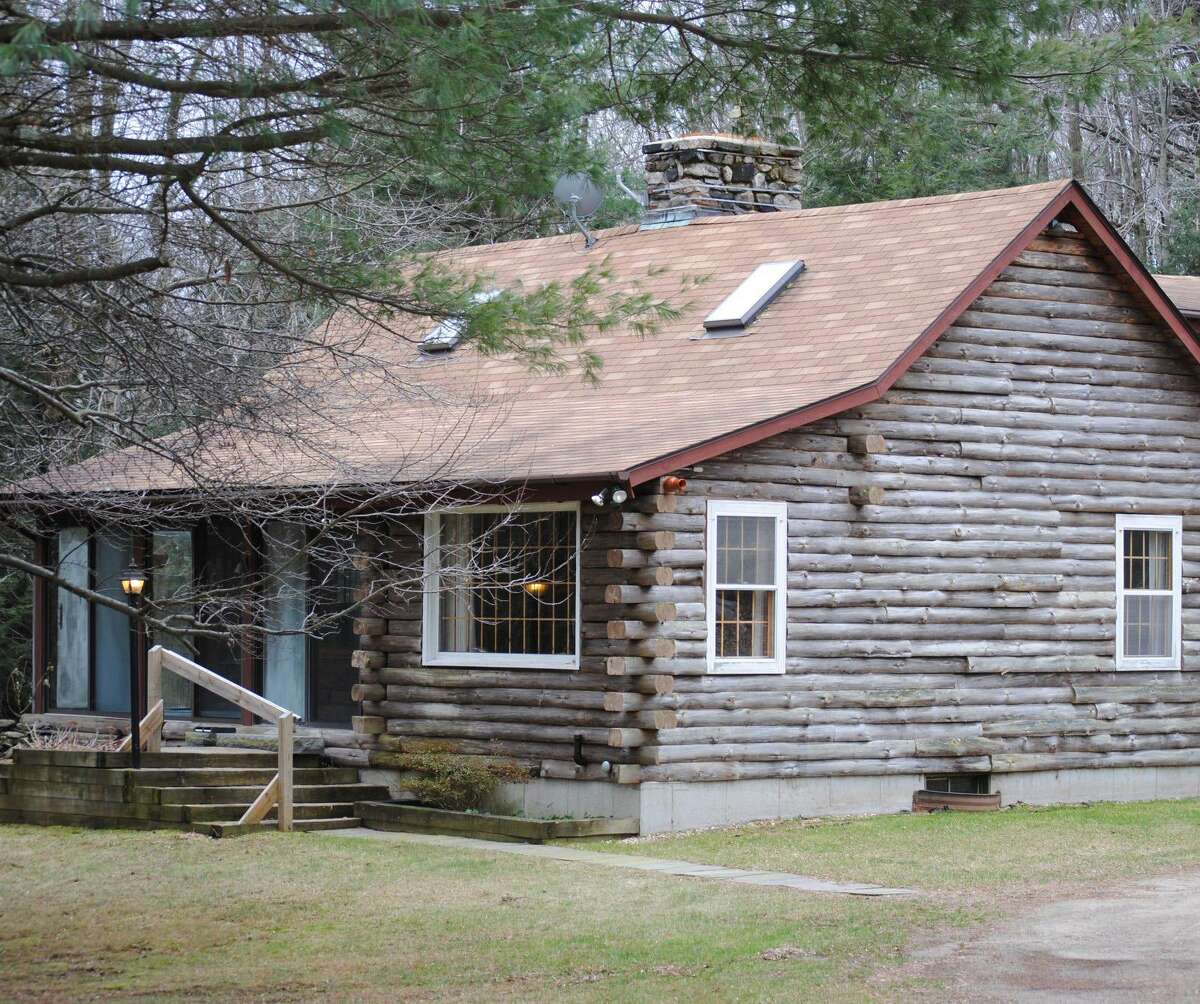 MIKE AGOGLIATI/Register Citizen This charming, owner-occupied log home in Colebrook is listed with Elyse Harney Real Estate.