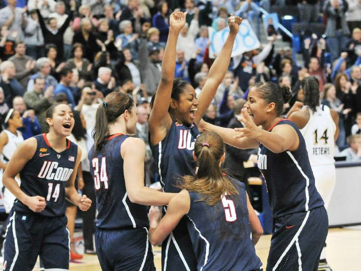 ASSOCIATED PRESS Connecticut Huskies guard Tiffany Hayes is surrounded by teammates Kaleena Mosqueda-Lewis, Caroline Doty, Kelly Faris, with Bria Hartley, as they celebrated a 63-54 win over Notre Dame on March 6 in the Big East Tournament Championship game at the XL Center in Hartford. The Huskies are the No. 1 seed in the Kingston (R.I.) Region and will play No. 16 Prairie View (17-15) in the first round on Saturday at 1:30 p.m. at the Webster Bank Arena in Bridgeport.
