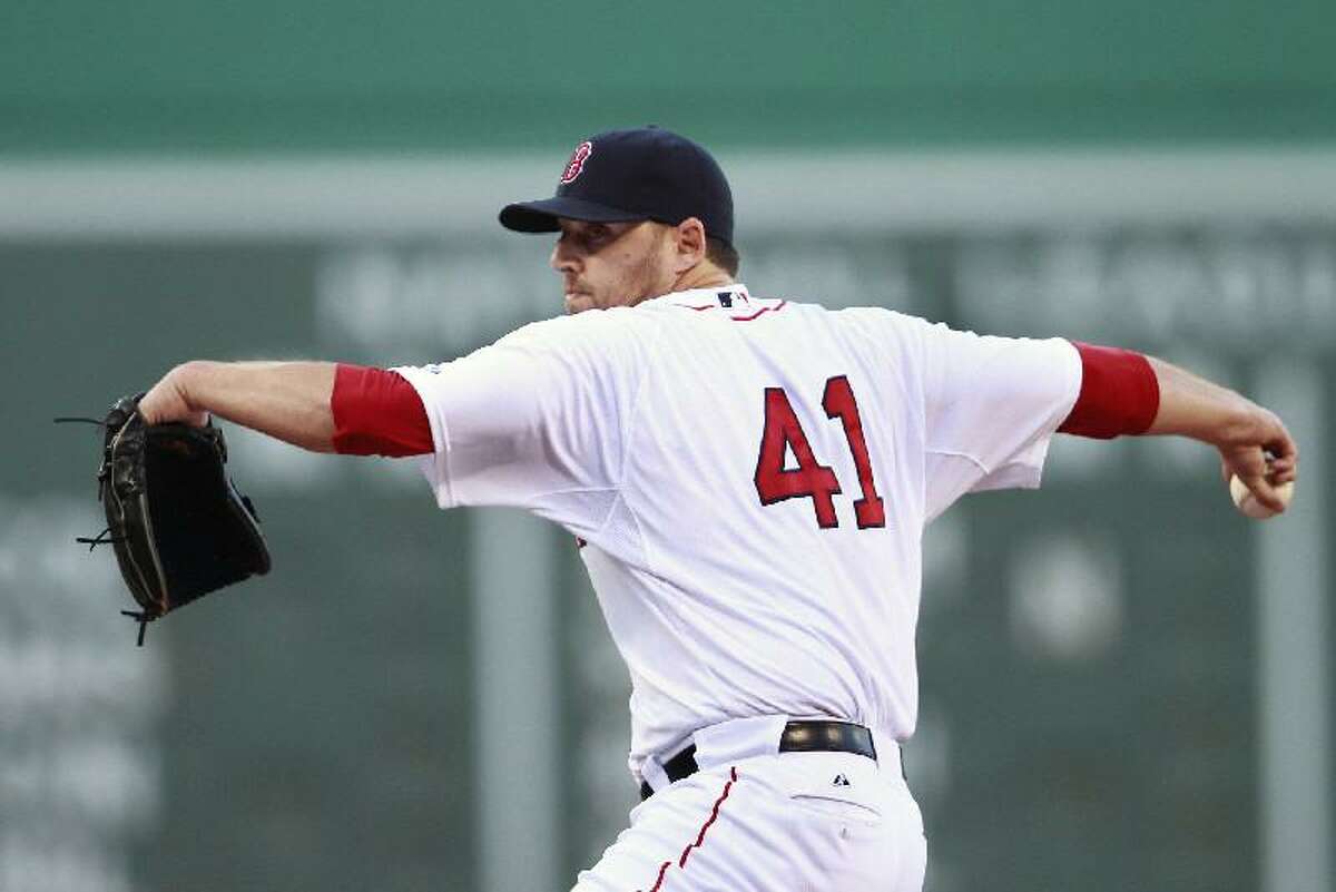 ASSOCIATED PRESS Boston Red Sox starting pitcher John Lackey throws in the first inning of Saturday's game against the Baltimore Orioles at Fenway Park in Boston. The Red Sox won 4-0 behind a solid effort from Lackey.