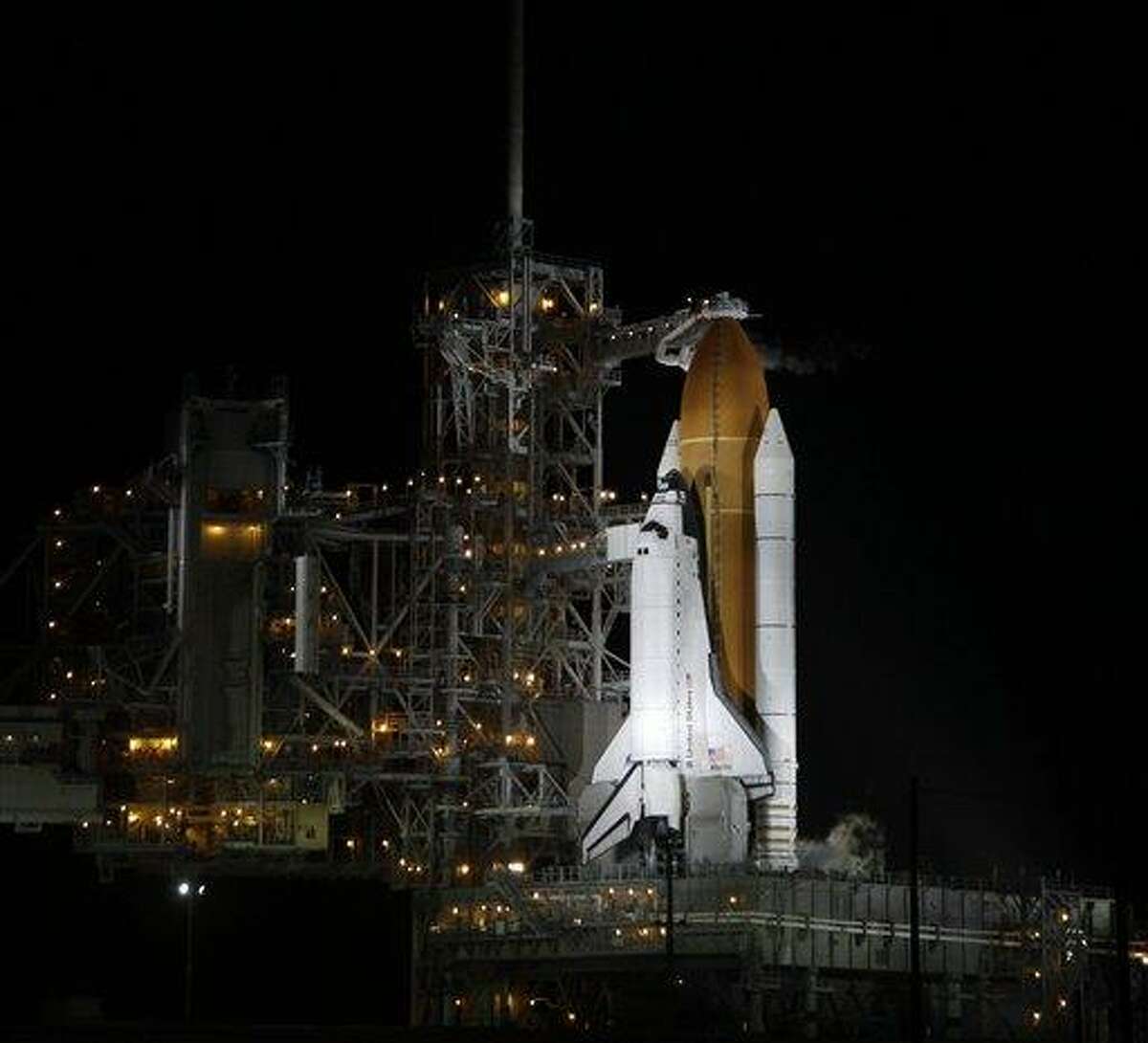 The space shuttle Atlantis is seen on the launch pad at the Kennedy Space Center Friday, July 8, 2011, in Cape Canaveral, Fla. Atlantis is scheduled to take off Friday and is the 135th and final space shuttle launch for NASA. (AP Photo/John Raoux)