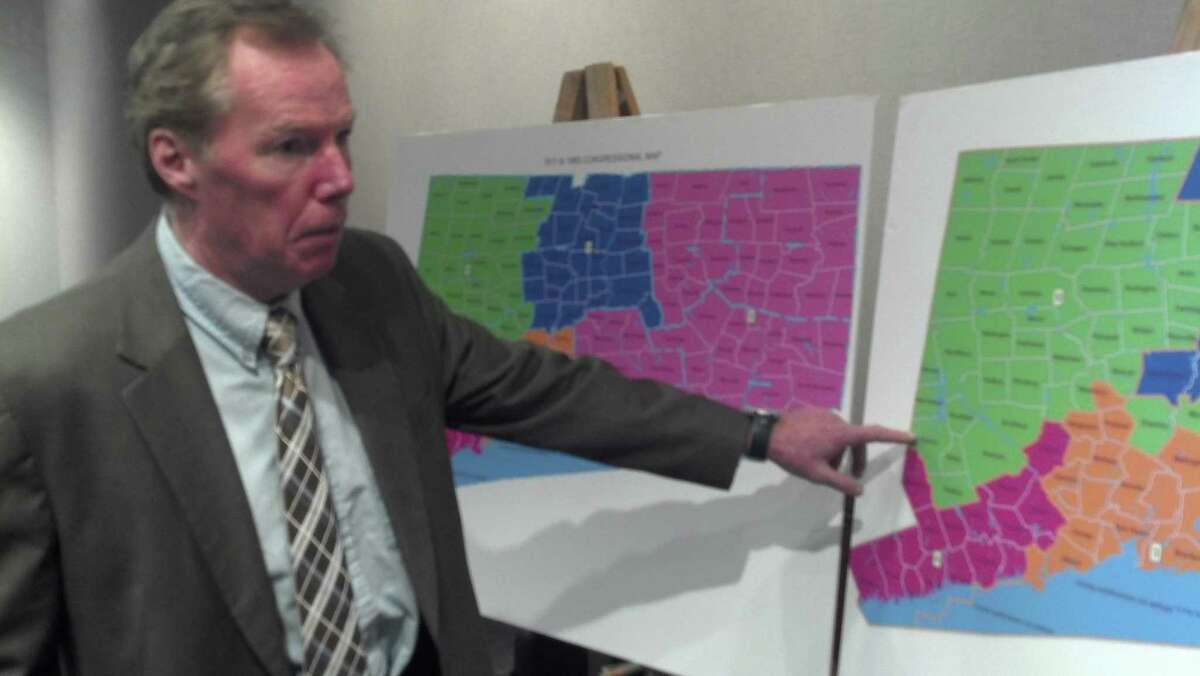 House GOP staffer Pat O'Neil sets up the various proposals for congressional redistricting. (Photo by Jordan Fenster)