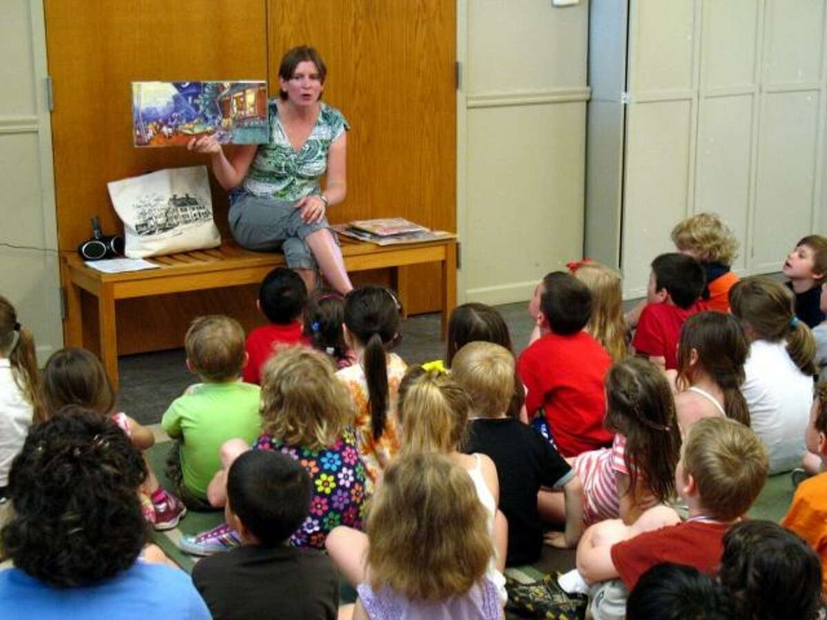 Children's librarian Lisa Shaia reads to Litchfield kindergarteners. Shaia's four years at the Oliver Wolcott Library have been marked with increased outreach to children and high program attendance. Photo courtesy of Oliver Wolcott Library.