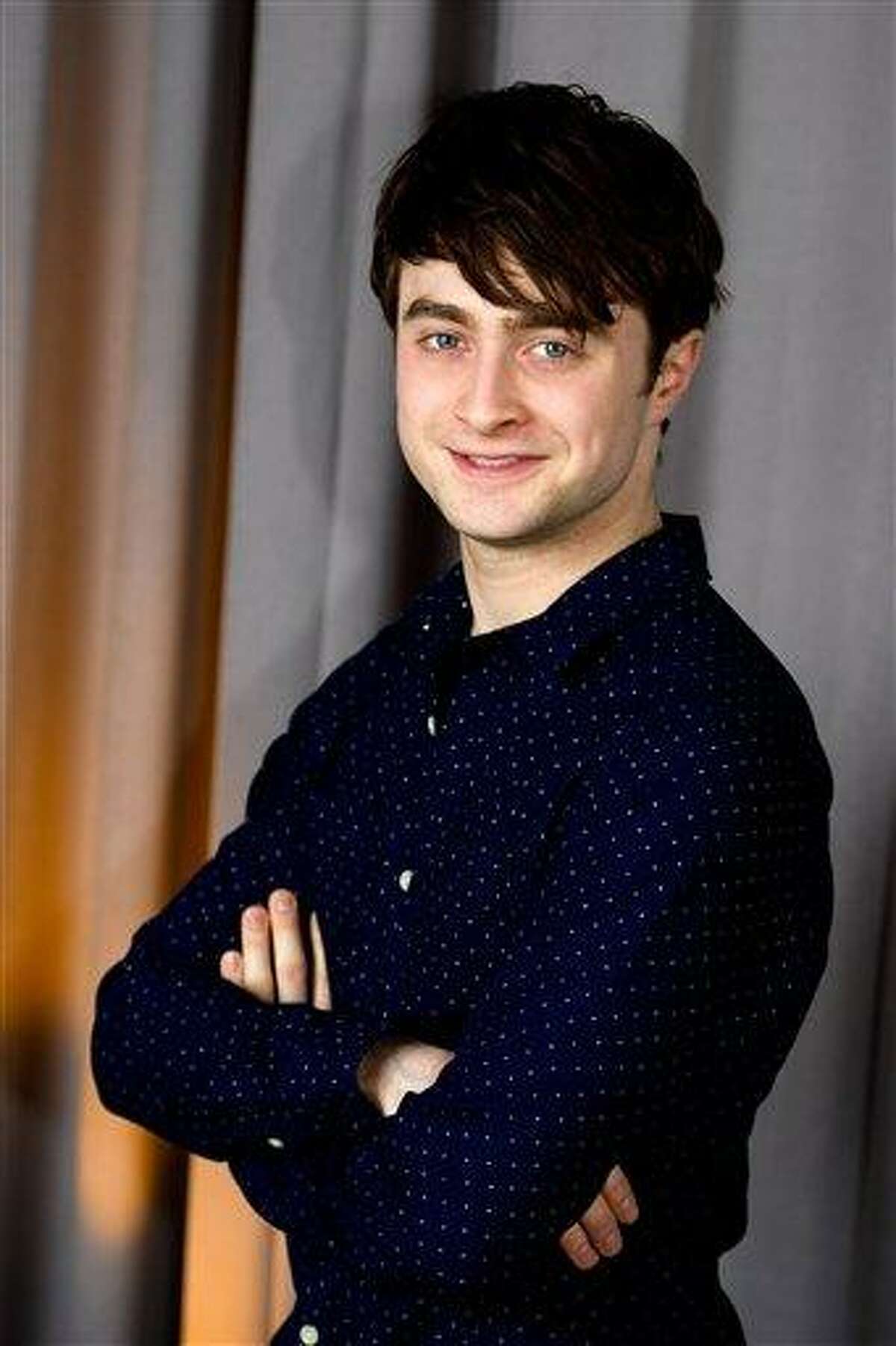 In this March 17, 2011 photo, actor Daniel Radcliffe poses for a portrait in New York. Radcliffe will be honored with the Trevor Project's Hero Award at a ceremony in New York in June, 2011. (AP Photo/Charles Sykes)