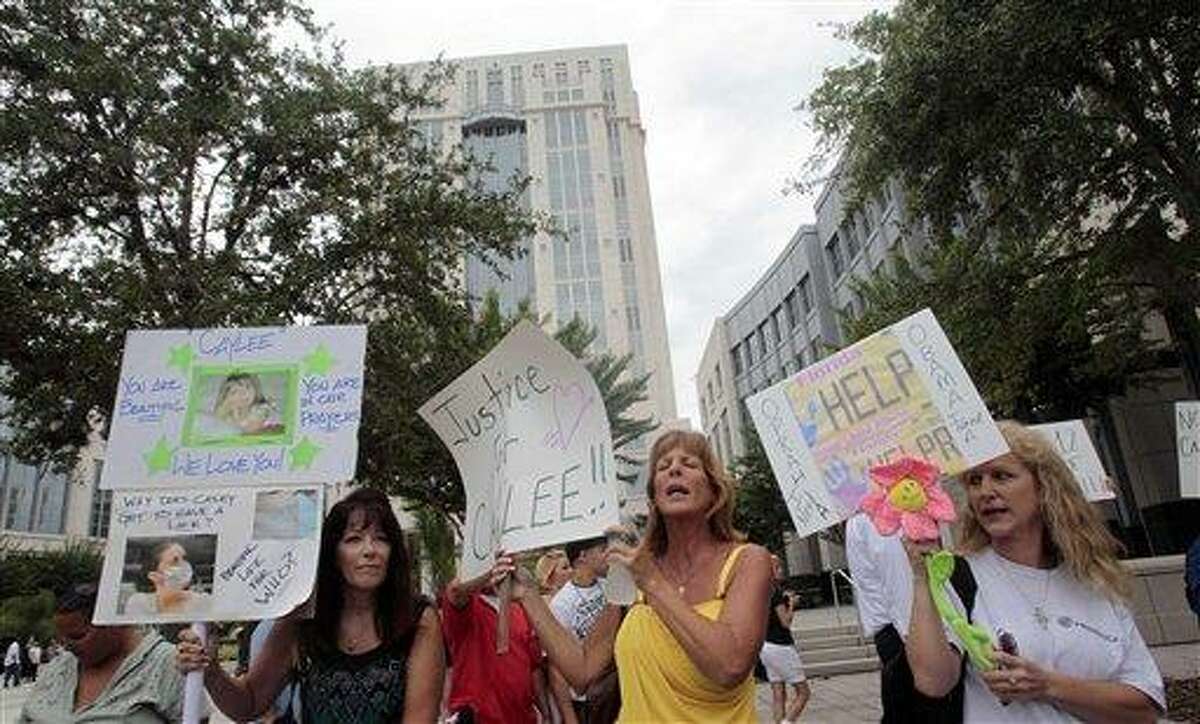 People dissatisfied with the the Casey Anthony verdict protest outside the Orange County Courthouse in Orlando, Fla., Thursday, July 7 2011. Casey Anthony, who was acquitted of killing her daughter, Caylee Anthony, faces sentencing for lesser charges today. (AP Photo/Alan Diaz)