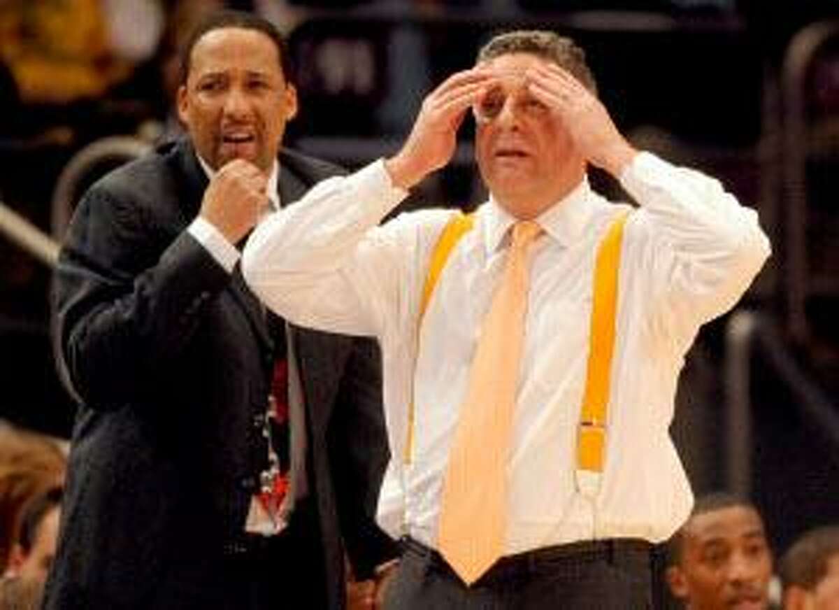 AP In this Nov. 26, 2010 file photo, Tennessee head coach Bruce Pearl, right, and associate head coach Tony Jones react during the second half of a game against Villanova in the finals of the NIT Season Tip-Off in New York. A person with knowledge of the decision says Tennessee has fired Pearl after a season that saw the coach charged with unethical conduct for lying to NCAA investigators during a probe into recruiting.