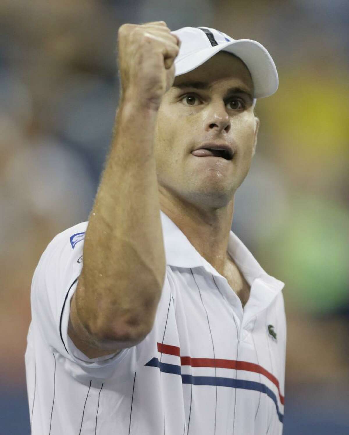 ASSOCIATED PRESS Andy Roddick reacts during his match against Australia's Bernard Tomic in the third round of play at the 2012 US Open tennis tournament on Friday night in New York. Roddick won the match.