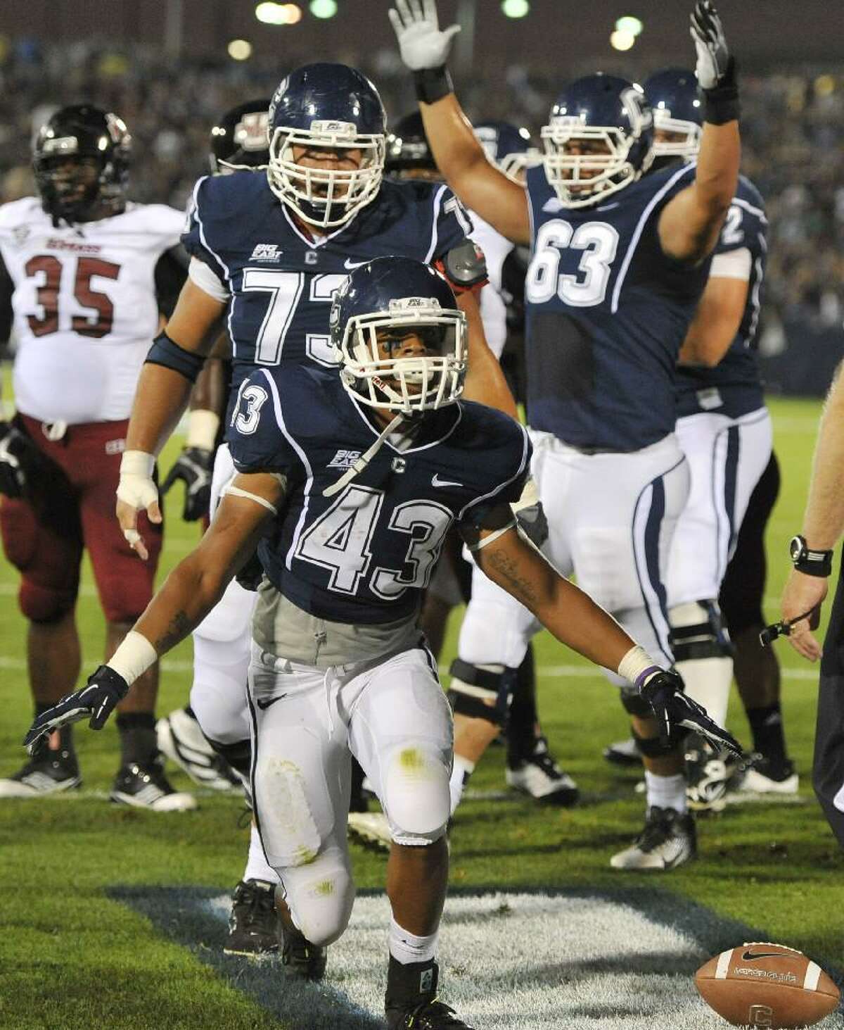 ASSOCIATED PRESS UConn running back Lyle McCombs (43) celebrates his touchdown against UMass during the first half of Thursday night's game at Rentschler Field in East Hartford.