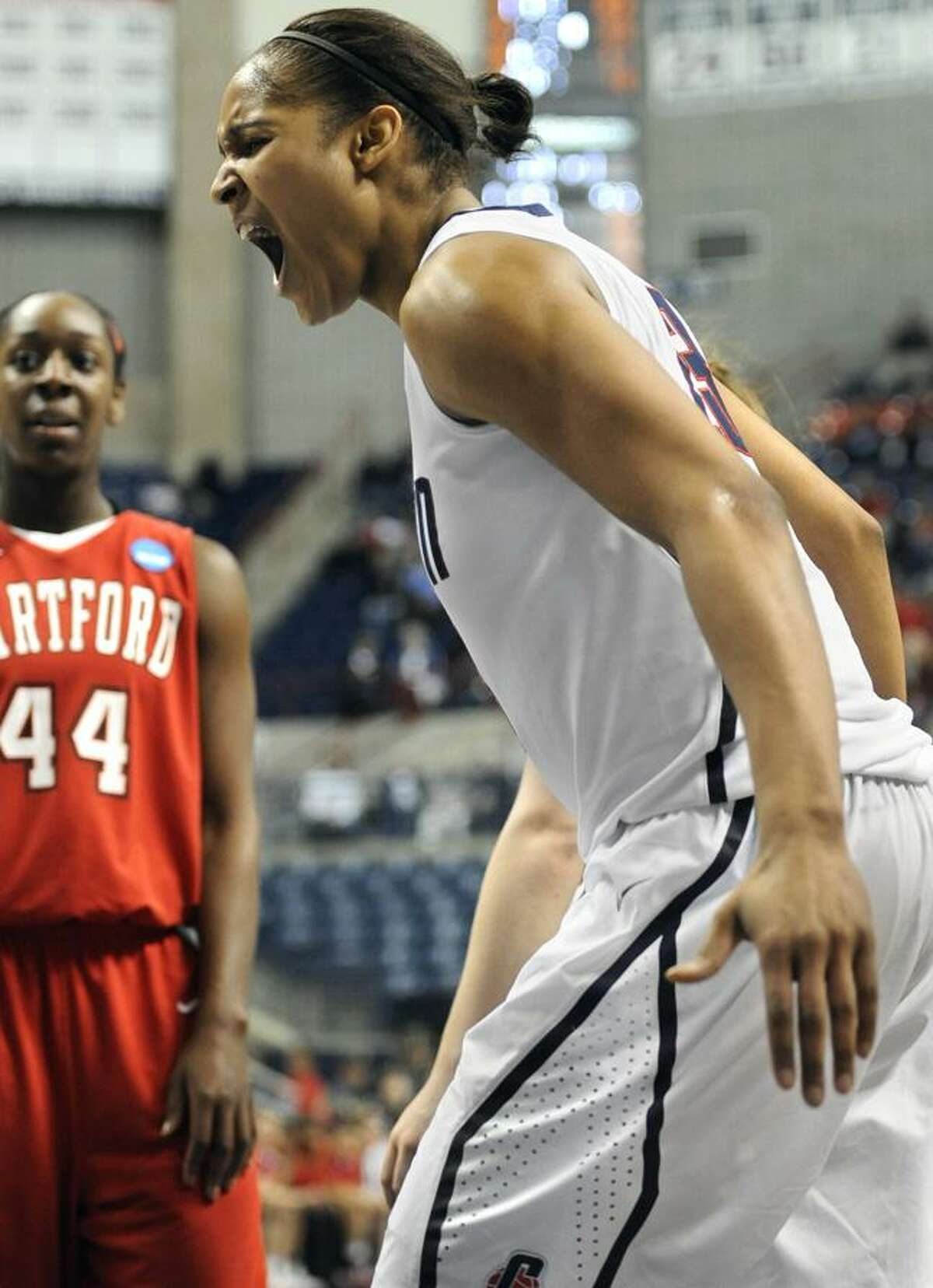 Connecticut's Maya Moore reacts after teammate Michala Johnson if fouled while making a basket against Hartford during the second half of an East regional first-round NCAA women's college tournament basketball game in Storrs, Conn., Sunday, March 20, 2011. (AP Photo/Jessica Hill)