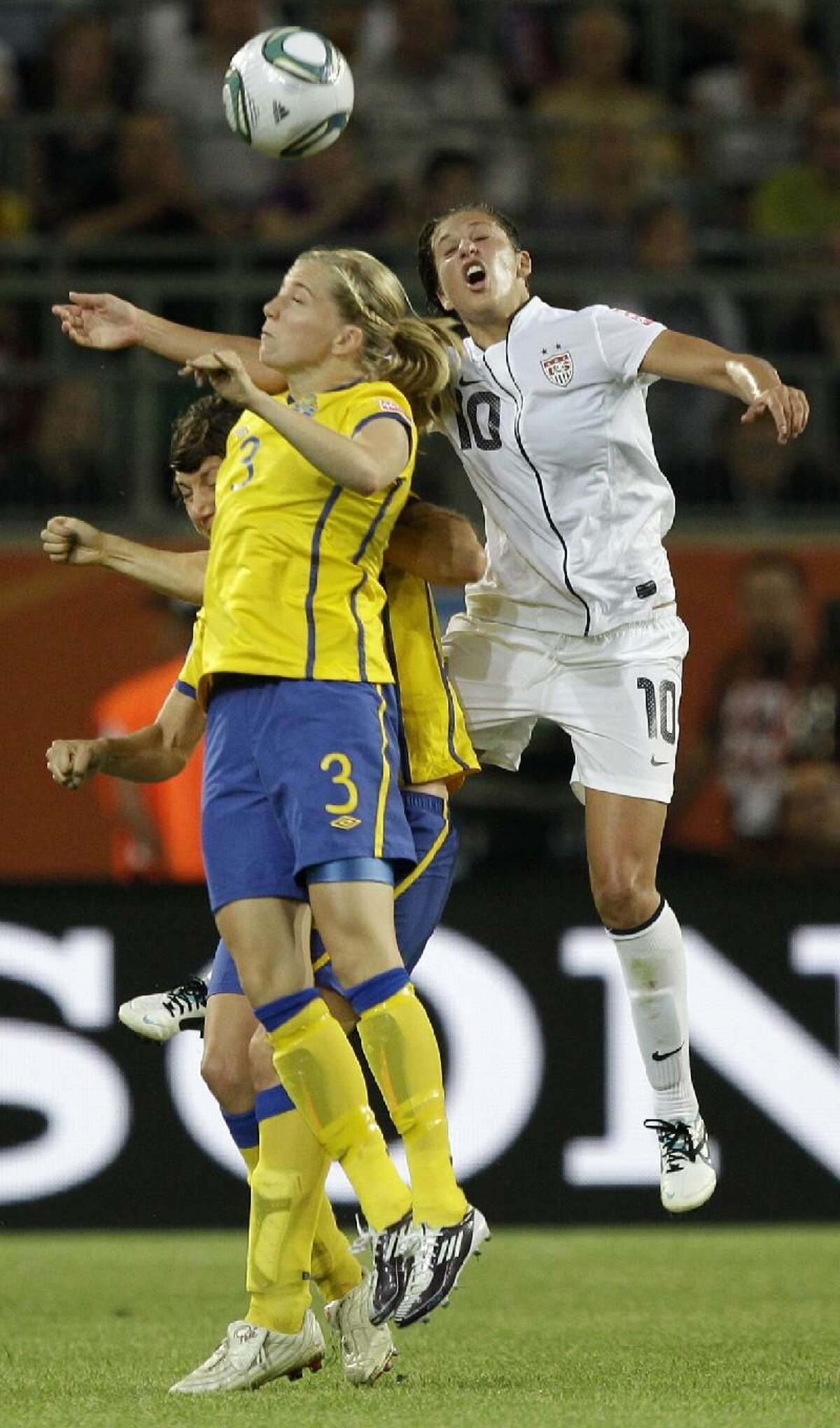 ASSOCIATED PRESS Sweden's Linda Sembrant, left, and United States' Carli Lloyd challenge for the ball during the group C match between Sweden and the United States at the Women's Soccer World Cup in Wolfsburg, Germany, Wednesday. Sweden won 2-1.