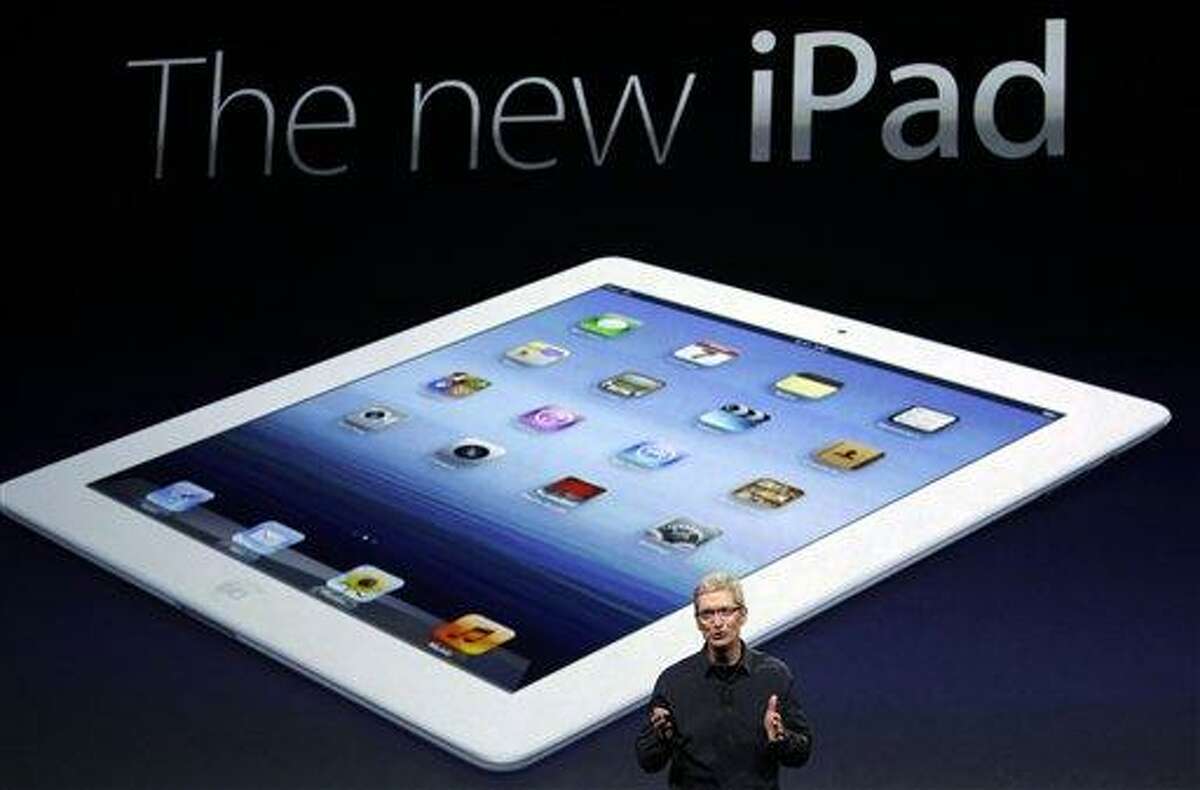 Apple CEO Tim Cook introduces the new iPad during an event Wednesday in San Francisco. The new iPad features a sharper screen and a faster processor. Apple says the new display will be even sharper than the high-definition television set in the living room. Associated Press