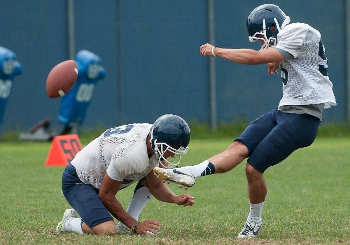BILL SHETTLE/CAL Sport Media via AP Images Kicker Chad Christen (13) in action during Connecticut's team practice on the campus of the University of Connecticut in Storrs on Aug. 14.