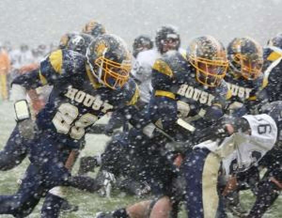 REGISTER CITIZEN FILE ART The Housatonic/Wamogo and Avon football teams hooked up in a memorable game during a freak October snowstorm this season. The Falcons won the game 17-14 in double overtime on a 23-yard field goal by Will DiStefano.