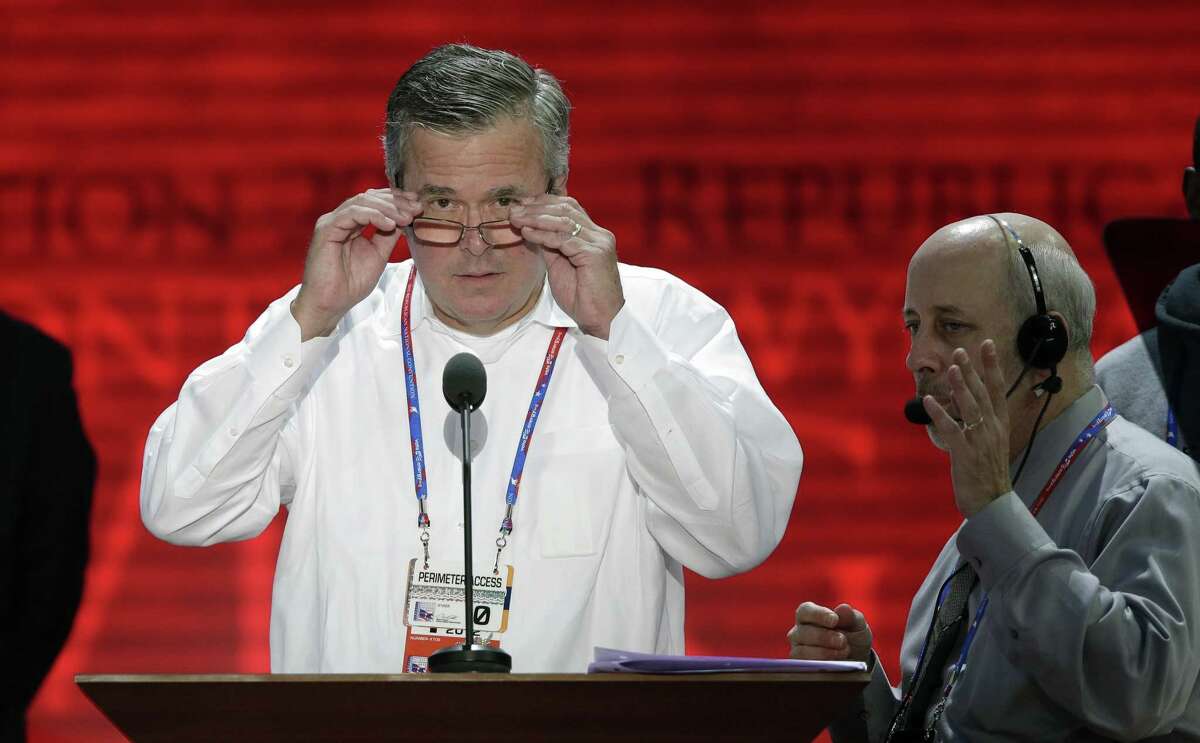 Former Florida Gov. Jeb Bush looks at the convention floor from the podium during a microphone check at the Republican National Convention in Tampa, Fla., on Monday, Aug. 27, 2012. (AP Photo/J. Scott Applewhite)