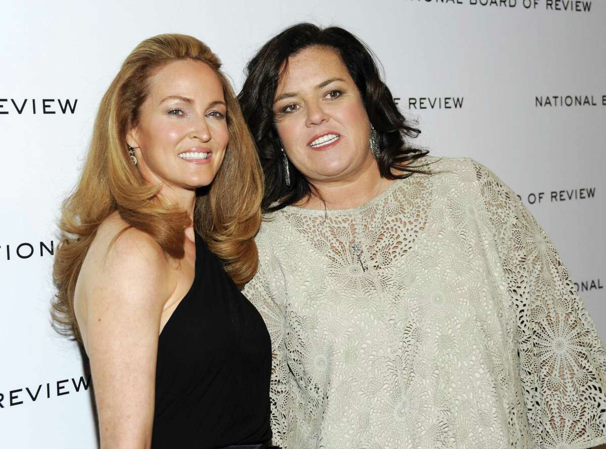 FILE - This Jan. 10, 2012 file photo shows television personality Rosie O'Donnell, right, and her girlfriend Michelle Rounds at the National Board of Review awards gala in New York. O'Donnell wed Rounds in a private ceremony in June, just days before Rounds had surgery to treat desmoid tumors. O'Donnell announced their marriage on her blog Monday, Aug. 27. The 50-year-old TV personality also says she is selling original artwork on eBay to raise money for the Desmoid Tumor Research Foundation. O'Donnell says she will match all funds raised with her own donation. (AP Photo/Evan Agostini, file)