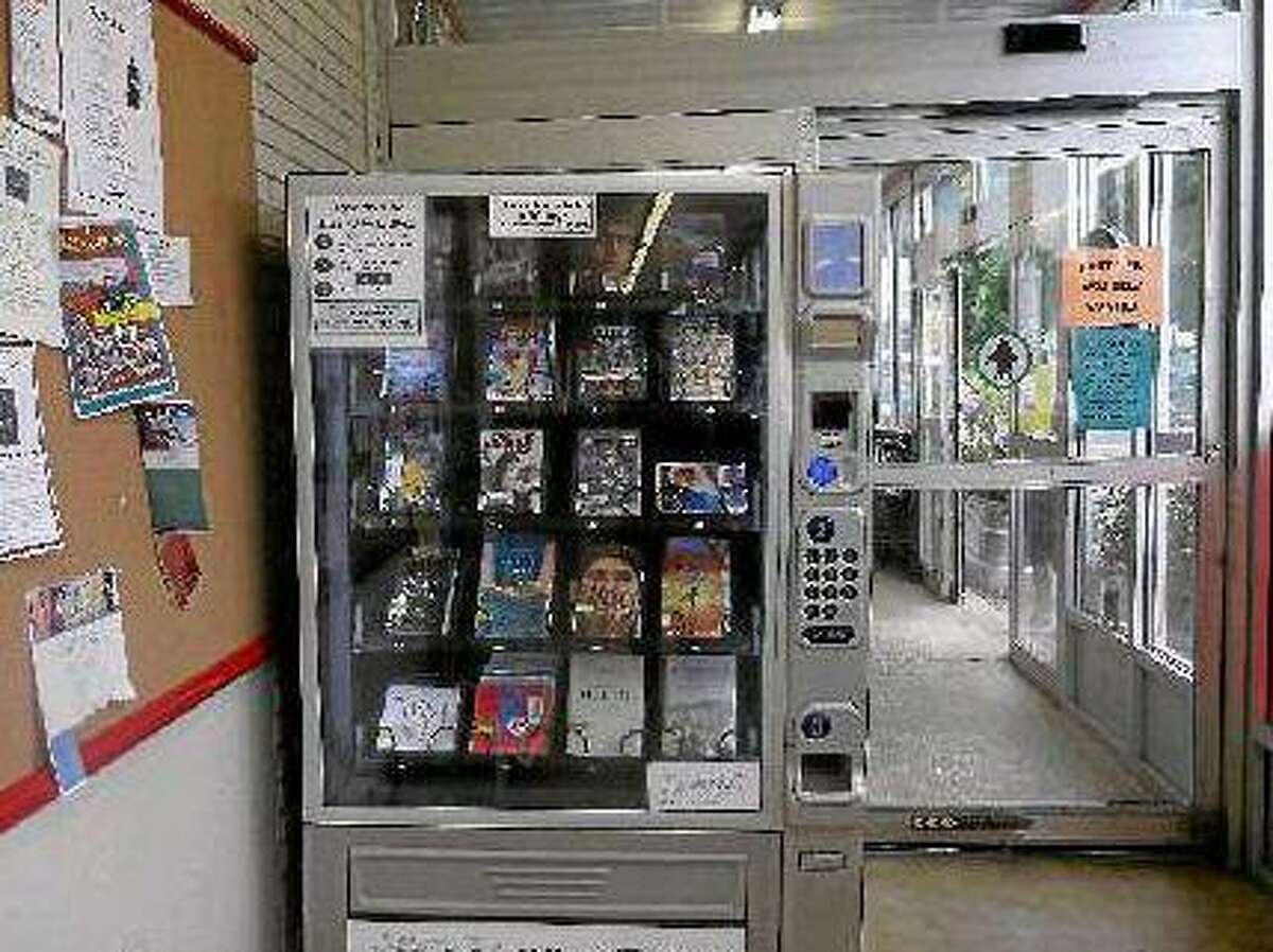 The OWL Box has been in Bantam Market since September 2010. Any Connecticut library card holder can rent books, DVDs or audiobooks from the machines and return them in a bin outside Bantam Market. (MICHELLE MERLIN/Register Citizen)