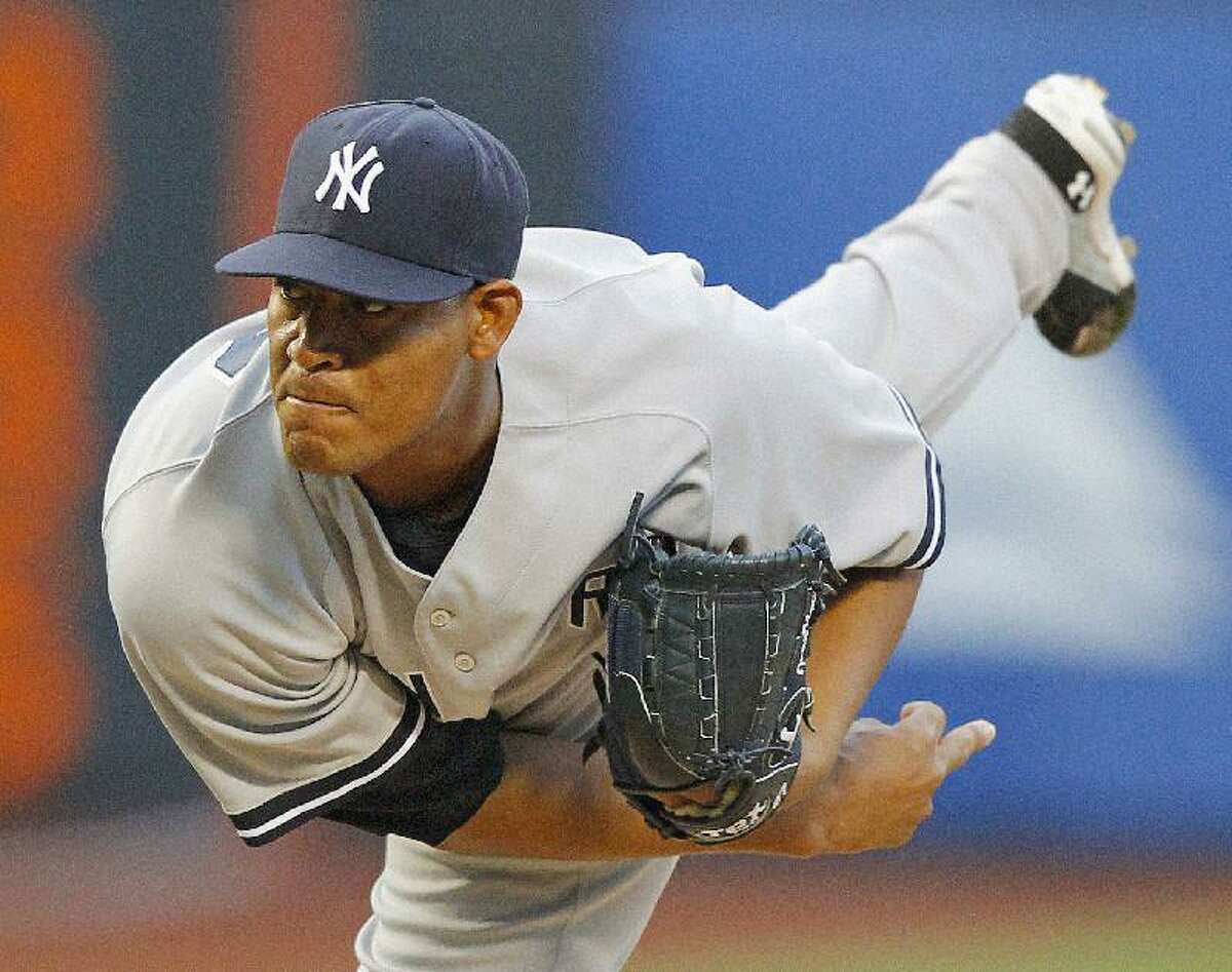ASSOCIATED PRESS New York Yankees starter Ivan Nova throws a pitch during the first inning of an interleague game against the New York Mets at Citi Field in New York Friday. The Yankees won 5-1.