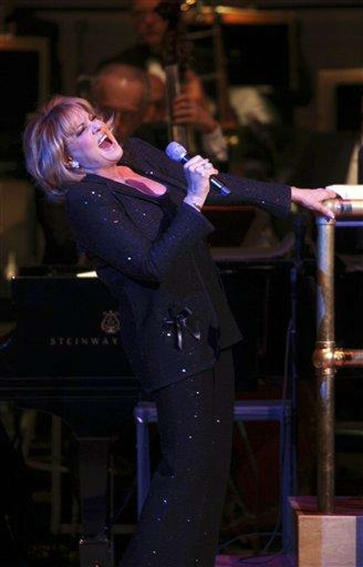 This Friday, March 11, 2011 photo courtesy of Steve J. Sherman for Carnegie Hall shows Lorna Luft, Judy Garland's daughter, as she sings with The New York Pops during a performance honoring Garland at Carnegie Hall in New York. They performed "Over the Rainbow," "The Trolley Song," "The Man That Got Away," and other songs from Garland's 1961 Carnegie Hall performance. (AP Photo/Carnegie Hall, Steve J. Sherman)