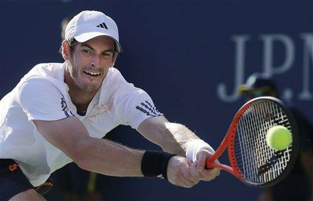 Britain's Andy Murray returns a shot to Alex Bogomolov Jr., of Russia, at the 2012 U.S. Open tennis tournament, Monday, Aug. 27, 2012, in New York. Murray won the match. (AP Photo/Mike Groll)