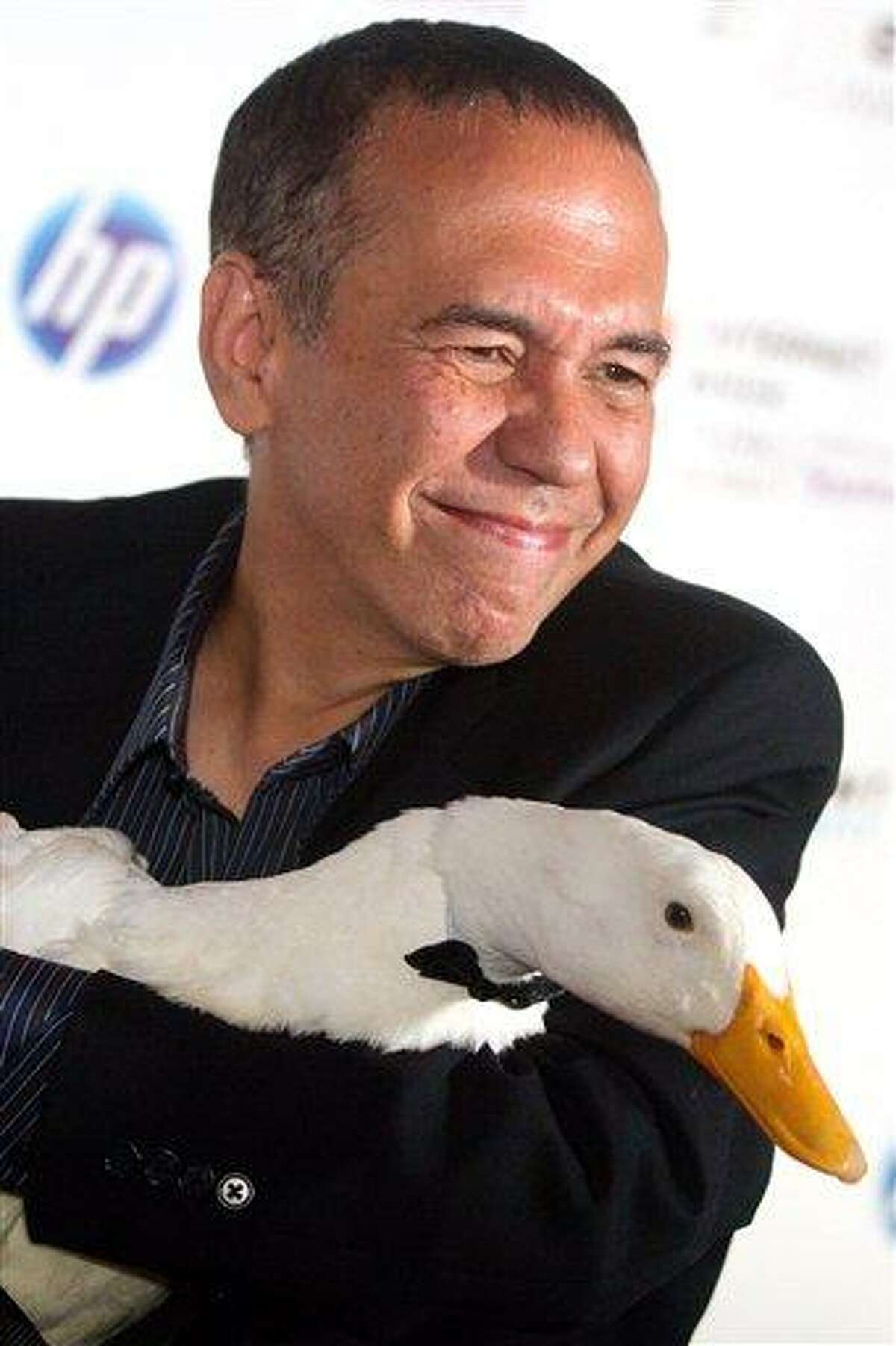 FILE - In this June 14, 2010 file photo, Gilbert Gottfried arrives with the Aflac duck to the 14th Annual Webby Awards in New York. Aflac on Monday, March 14, 2011 announced that it has severed ties with Gottfried over jokes about the earthquake and tsunami in Japan that the comedian posted on Twitter. (AP Photo/Charles Sykes, File)