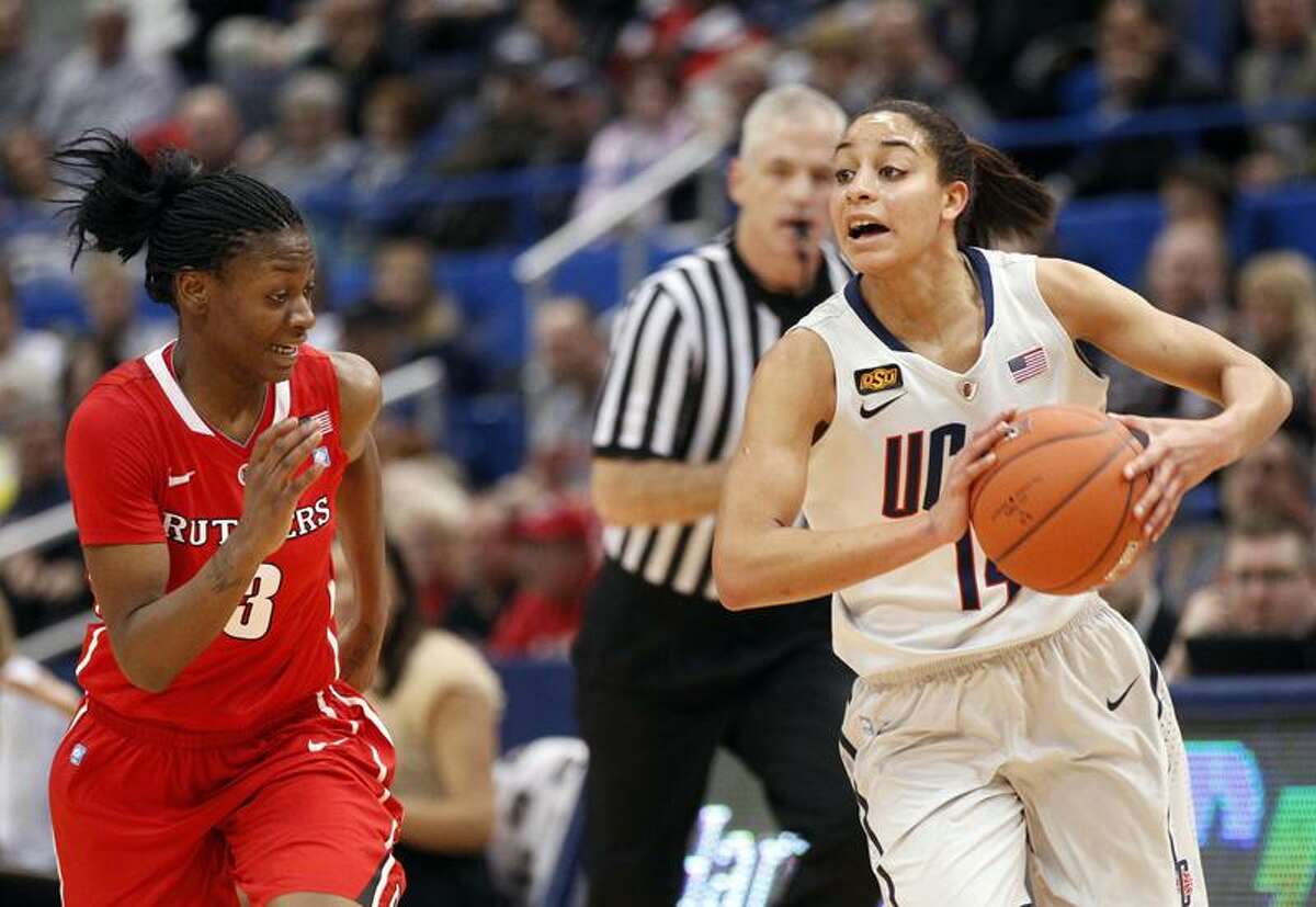 Mar 04, 2012; Hartford, CT, USA; Connecticut Huskies guard Bria Hartley (14) drives the ball against Rutgers Scarlet Knights guard Erica Wheeler (3) during the first half of the quarterfinals of the 2012 Big East Tournament at the XL Center. Mandatory Credit: David Butler II-US PRESSWIRE