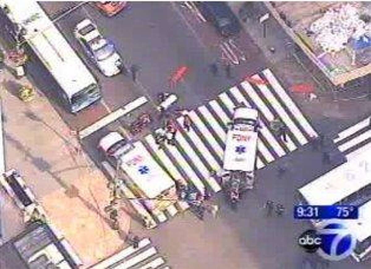 In this frame grab from WABC-TV, emergency personnel respond to reports of several people being shot outside the Empire State Building, Friday, Aug. 24, 2012, in New York. Authorities say the shooter is dead. (AP Photo/WABC-TV) MANDATORY CREDIT