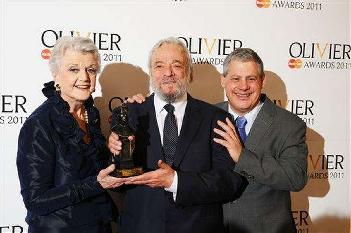 Stephen Sondheim, American composer and lyricist for stage and film, centre, wins the Society of London Theatre Special Award, presented by Angela Lansbury and Sir Cameron Mackintosh, at the 2011 Laurence Olivier Awards at the Theatre Royal in London Sunday, March 13 2011. (AP)