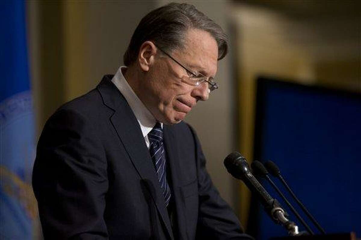 The National Rifle Association executive vice president Wayne LaPierre pauses as he makes a statement during a news conference in response to the Connecticut school shooting, on Friday, Dec. 21, 2012 in Washington. The National Rifle Association broke its silence Friday on last week's shooting rampage at a Connecticut elementary school that left 26 children and staff dead. (AP Photo/ Evan Vucci)