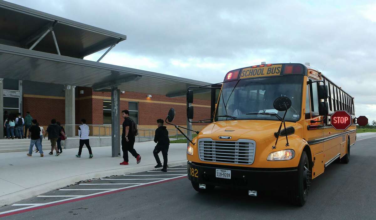 Students arrive for class at Southwest Legacy High School in the Southwest ISD. The district is facing a "higher than normal" absences due to COVID.