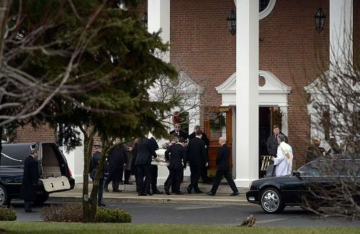 Pallbearers carry the casket of Olivia Engel, 6, into St. Rosa Lima church in Newtown for her funeral December 21, 2012. Engel was one of the 26 Sandy Hook Elementary school victims from the Friday mass shooting. Photo by Mahala Gaylord