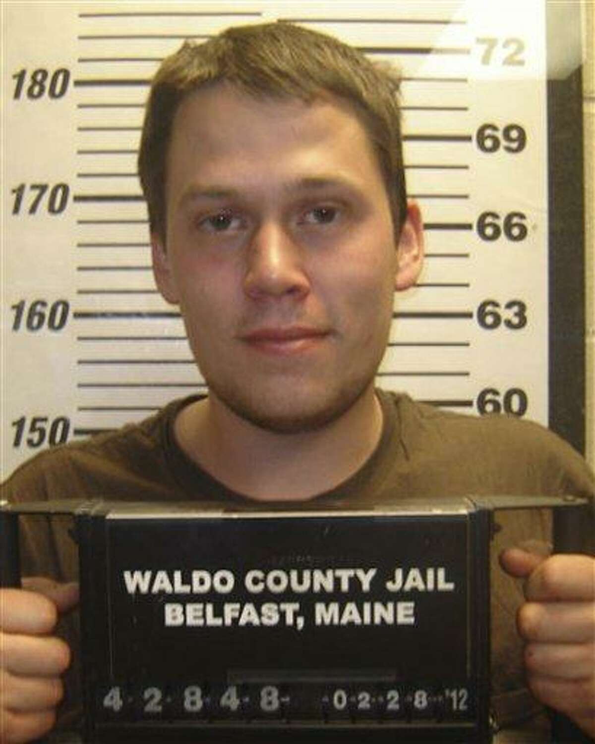 Maine police say they charged 24-year-old Daniel Porter, pictured here at the Waldo County Jail, in the death of Jerry Perdomo of Seminole County, Florida, who had been missing since Feb. 16. Associated Press