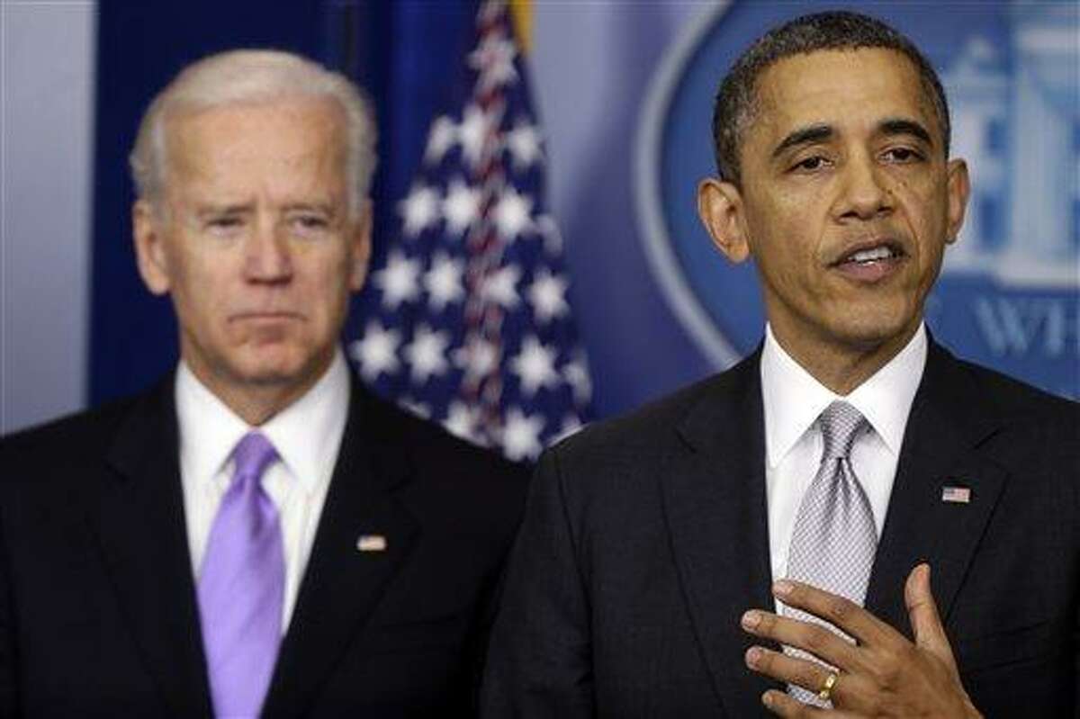 President Barack Obama stands with vice president Joe Biden as he makes a statement Wednesdayin the Brady Press Briefing Room at the White House in Washington, about policies he will pursue following the massacre at Sandy Hook Elementary School in Newtown, Ct. Obama is tasking Vice President Joe Biden, a longtime gun control advocate, with spearheading the effort. AP Photo/Charles Dharapak