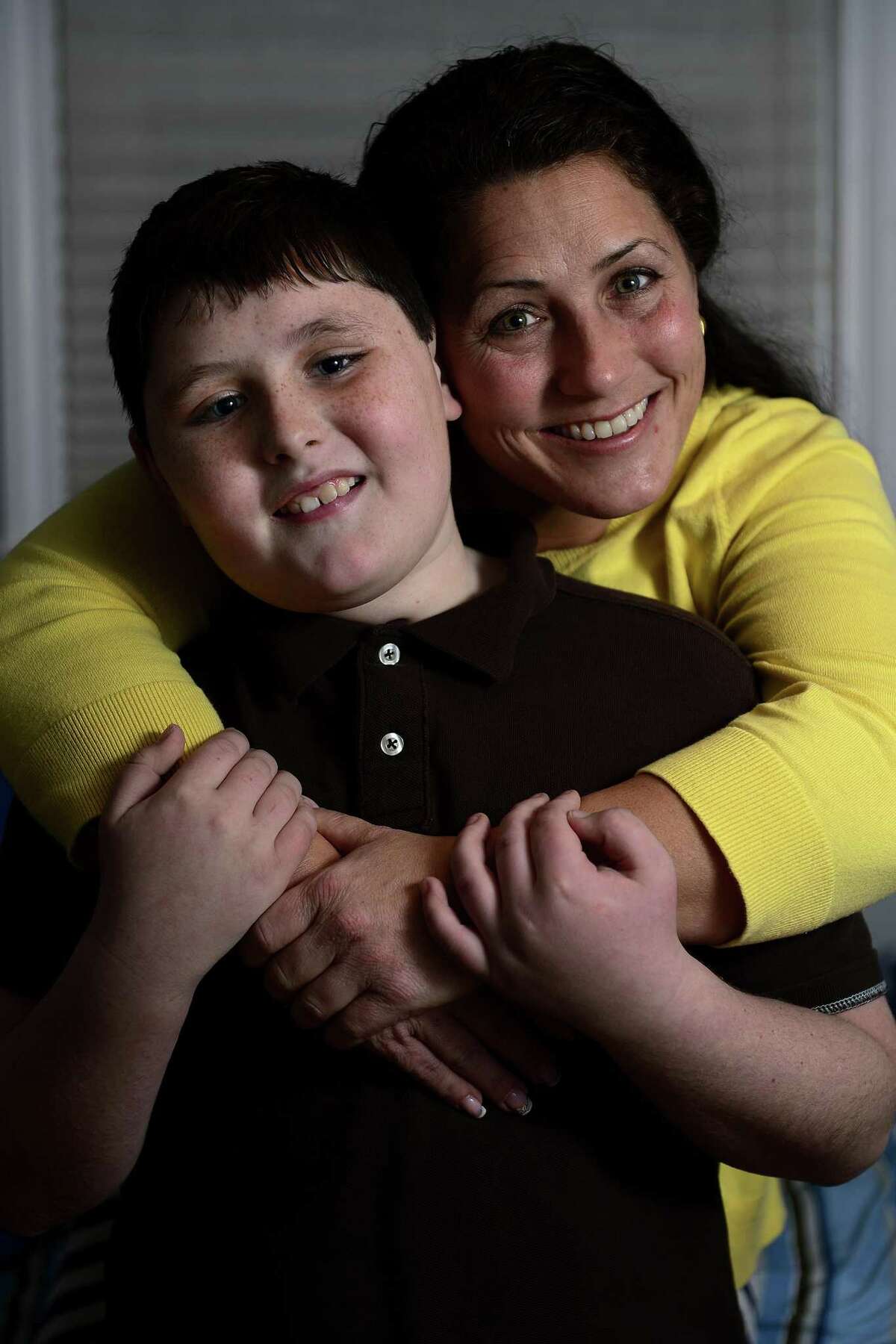 Julie Shafer and her son Caleb Shafer Courder, 10, they talk about Caleb's Asperger's diagnosis at their home in Quaker Hill, Connecticut on Wednesday, December 19, 2012. AAron Ontiveroz, The Denver Post