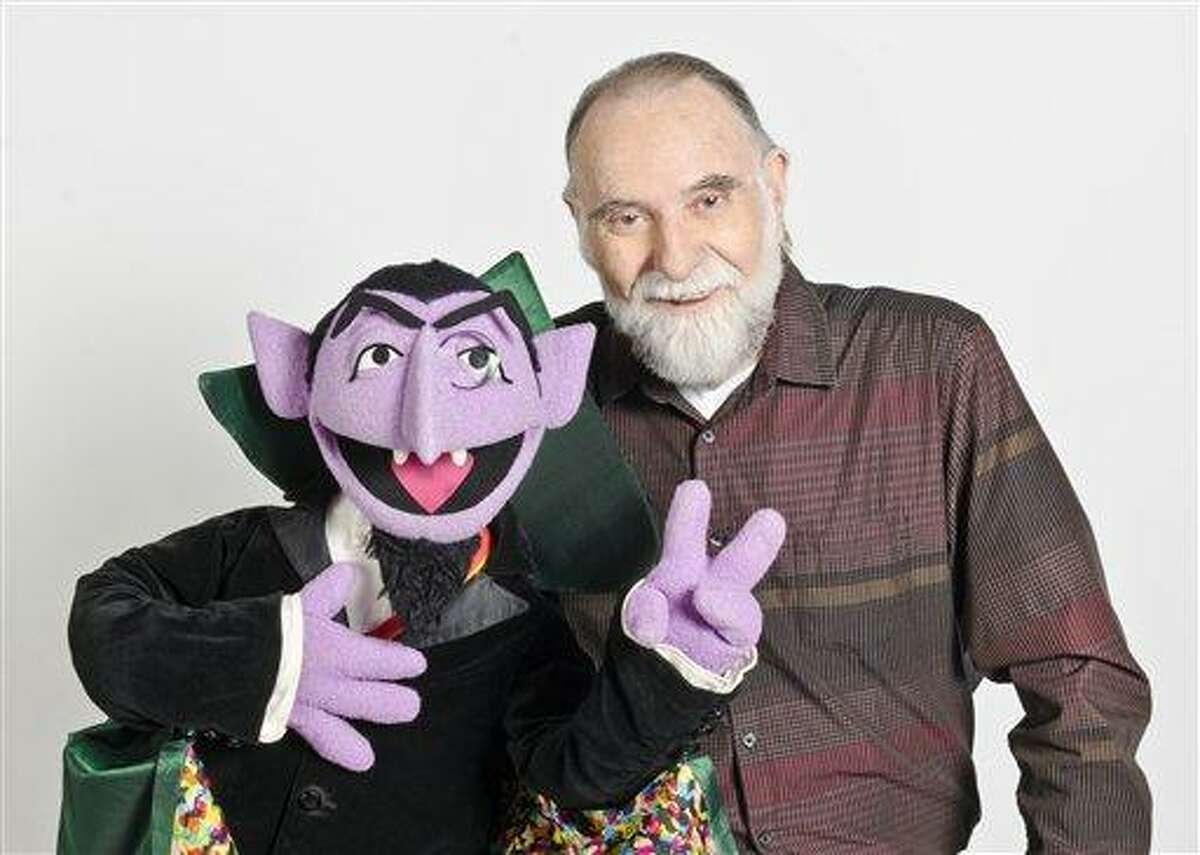 In this June 2012 publicity photo released by "Sesame Street," puppeteer Jerry Nelson is shown with "Sesame Street" character Count von Count in New York. Sesame Workshop announced that Nelson, who suffered from emphysema, died at age 78 on Thursday, Aug. 23, 2012, in his Massachusetts home on Cape Cod. (AP Photo/Sesame Workshop, Gil Vaknin)