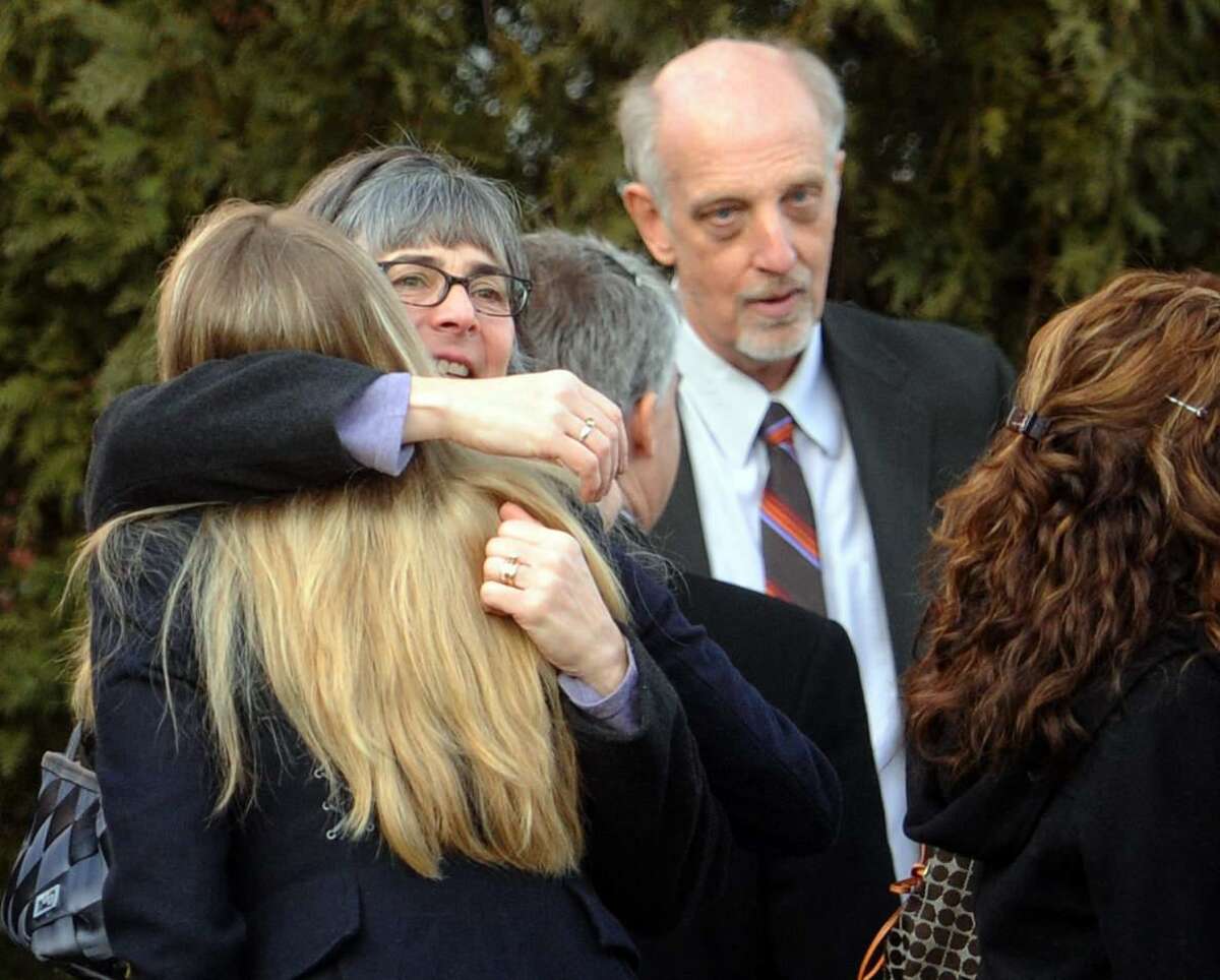 Bill Leukhardt, right,with mourners after a memorial service for Lauren Rousseau, at the First Congregational Church in Danbury, Conn. Thursday, December 20, 2012. Rousseau and her mother Teresa Rousseau lived with Leukhardt. Leukhardt and Teresa Roussea are partners. Lauren Rousseau was a substitute teacher killed by a gunman that also claimed the lives of 5 other educators and 20 children at the Sandy Hook Elementary School shooting Friday, December 15, 2012. Leukhardt Photo by Peter Hvizdak / New Haven Register