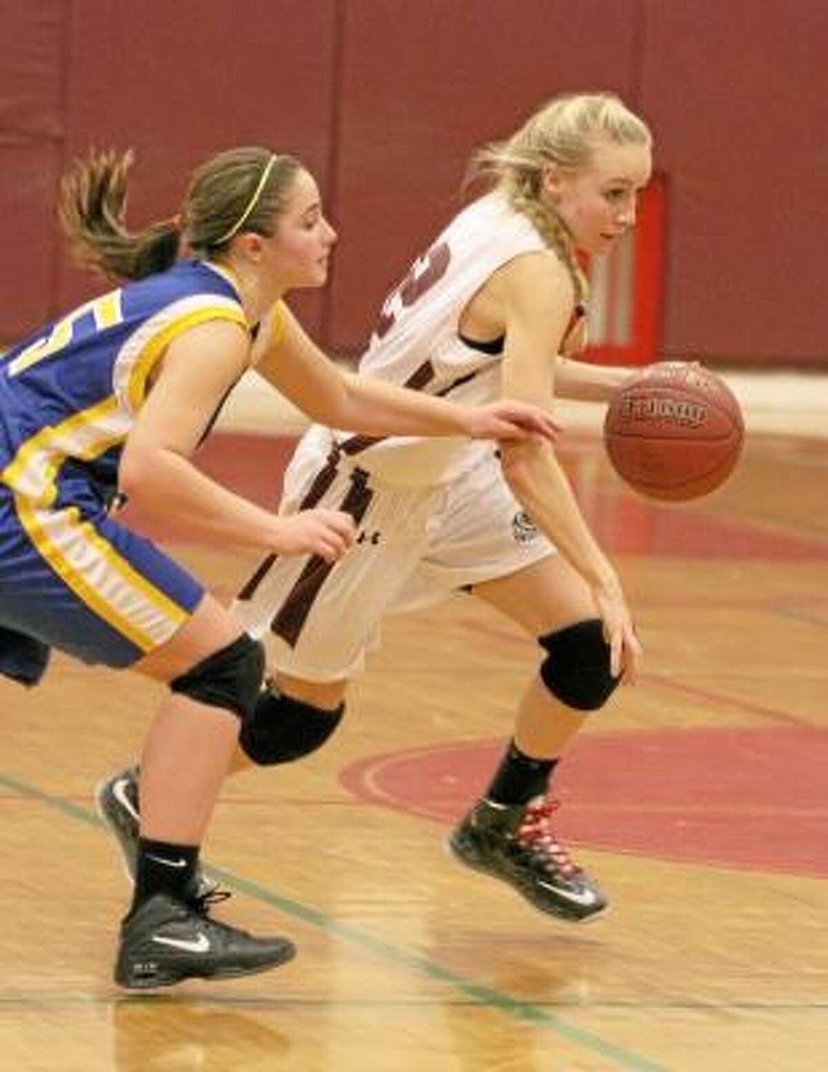 Torrington's Paige Middleton dribbles down the court. Photo by Marianne Killackey/Special to Register Citizen