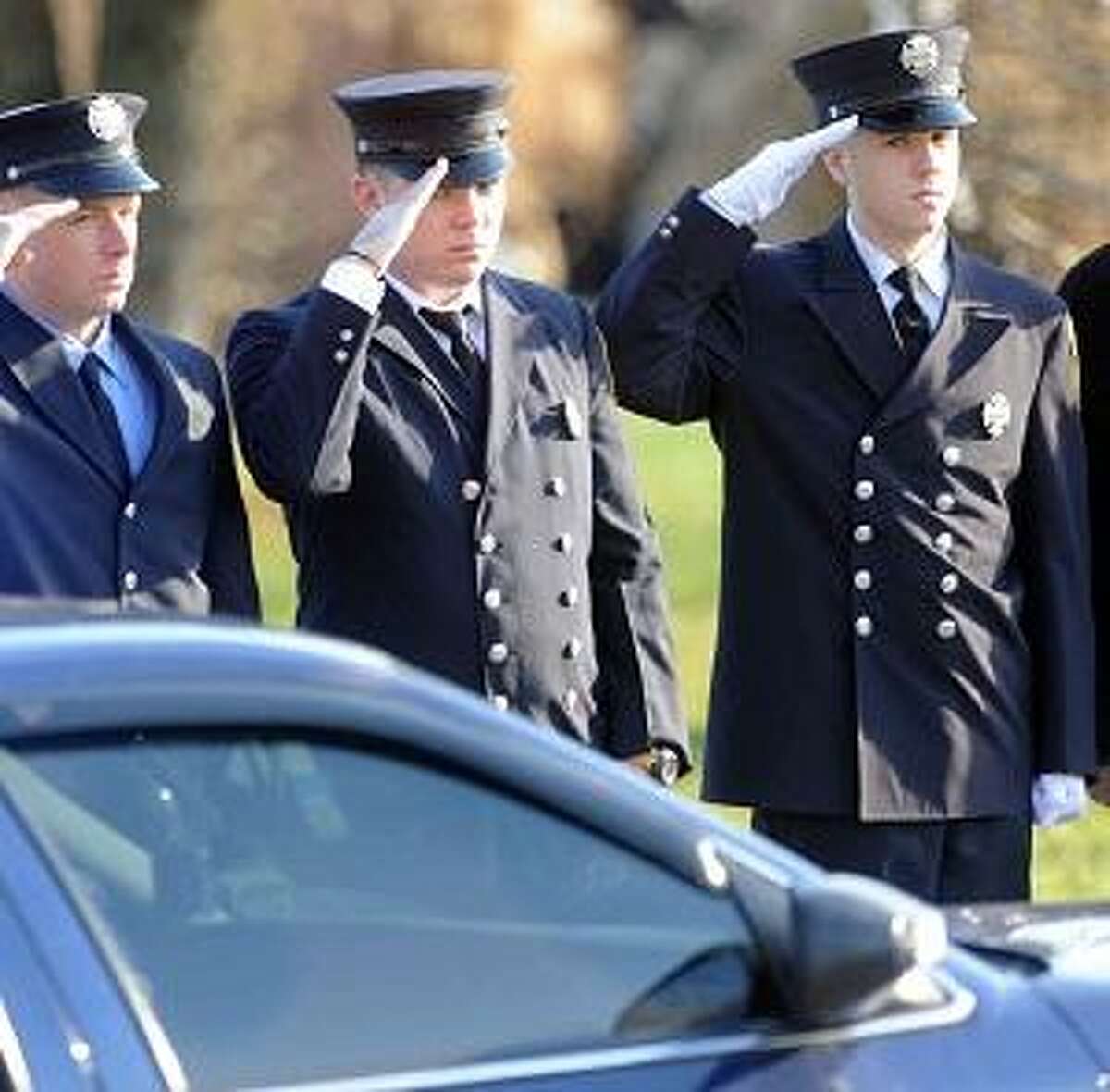 Connecticut firefighters from around the state stand as an honor guard during the funeral for Daniel Barden , 7, of at the St. Rose of Lima Roman Catholic Church in Newton, Conn. Wednesday, December 19, 2012, who was killed by a gunman that also claimed the lives of 6 adults and 19 other children at the Sandy Hooky Elementary School shooting Friday, December 14, 2012. Photo by Peter Hvizdak / New Haven Register