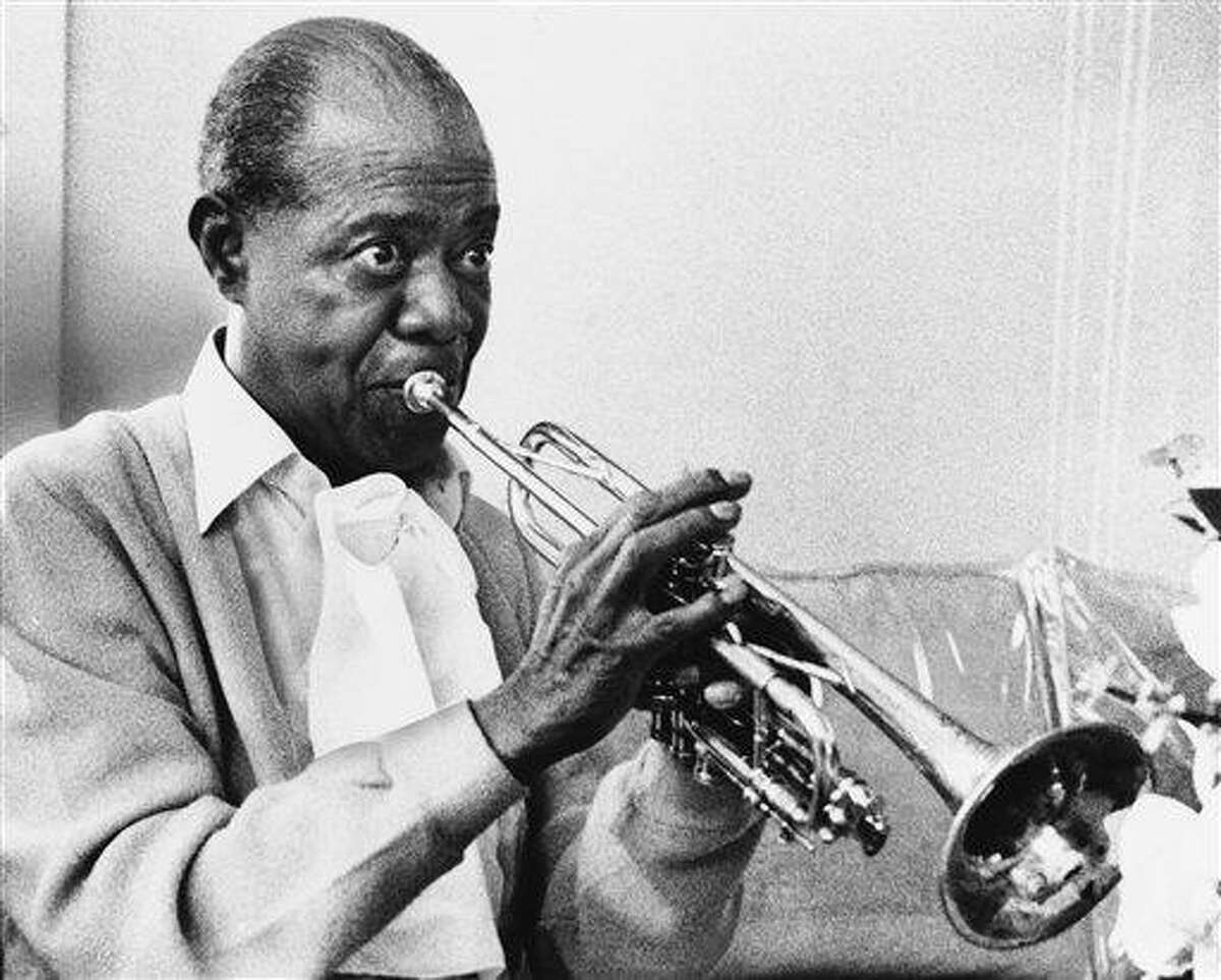 In a June 21, 1971 file photo jazz great Louis Armstrong practices with his horn at his Corona, New York home on June 21, 1971. A live recording of Louis Armstrong playing his trumpet for one of the last times is being played Friday at the National Press Club in Washington where it was created in January 1971. (AP Photo/Eddie Adams, file)