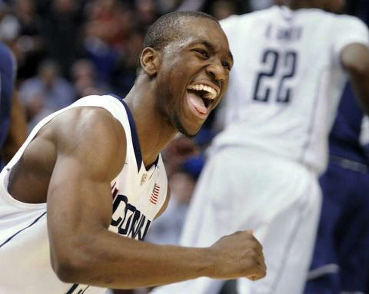 Connecticut's Kemba Walker celebrates after scoring two of his game-high 31, points during the second half of Connecticut's 78-70 victory over Georgetown in an NCAA college basketball game in Hartford, Conn., on Wednesday, Feb. 16, 2011. (AP Photo/Fred Beckham)