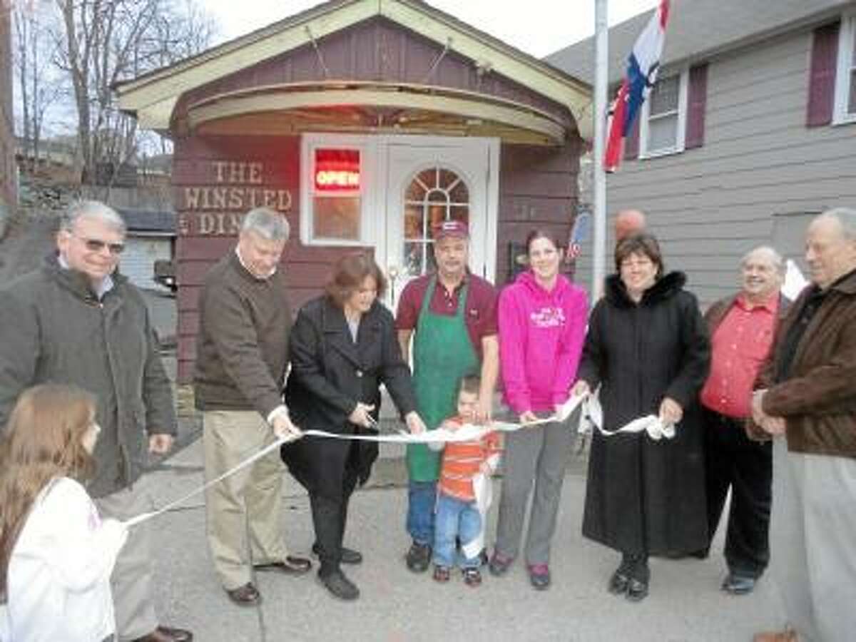 JASON SIEDZIK/ Register Citizen Winchester Mayor Maryann Welcome, third from left, prepares to cut the ribbon at the Winsted Diner's reopening.