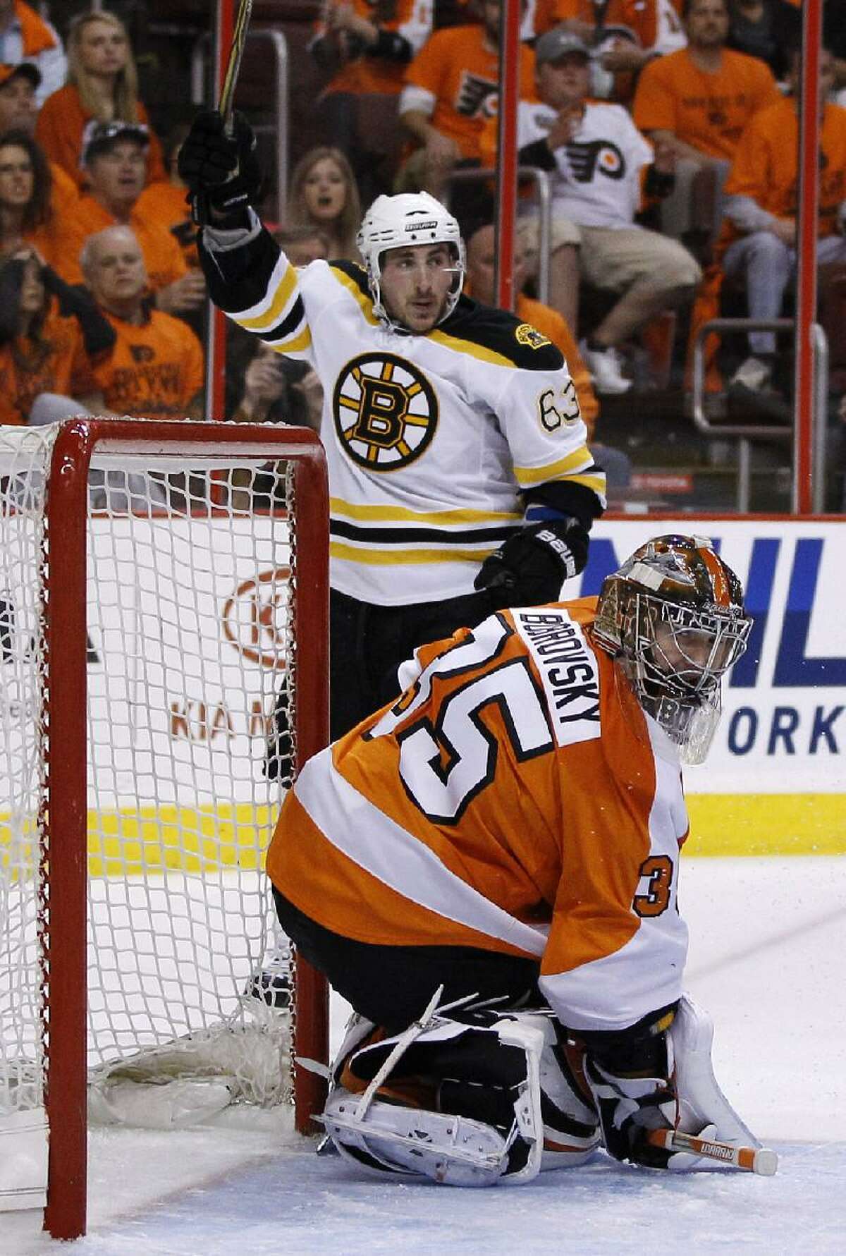 ASSOCIATED PRESS Boston's Brad Marchand (63) reacts after scoring a goal against Philadelphia's (35) during the third period in Game 1 of the Eastern Conference semifinal Stanley Cup playoffs series in Philadelphia. Boston won 7-3.