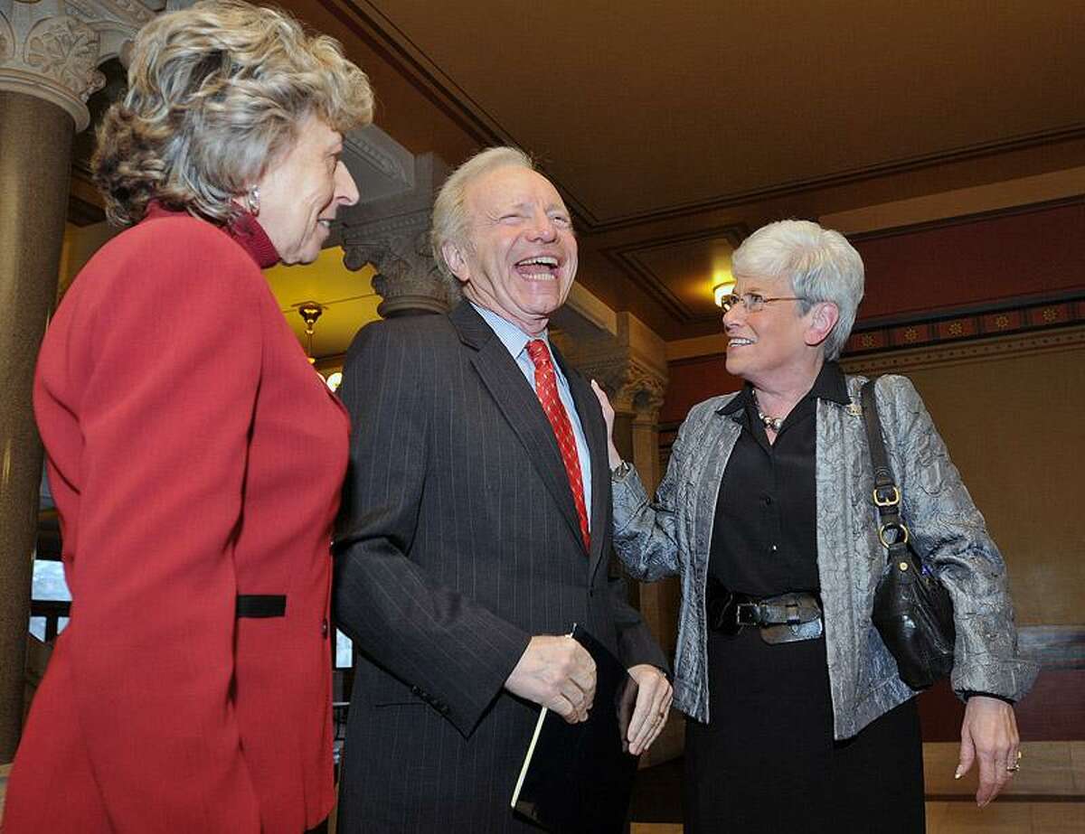 Sen. Joseph Lieberman shares a laugh with Lt. Governor Nancy Wyman and his wife, Hadassah, before a press conference Monday at the Capitol building in Hartford. Lieberman announced he will start a scholarship fund for Connecticut high school students. Peter Casolino/Register