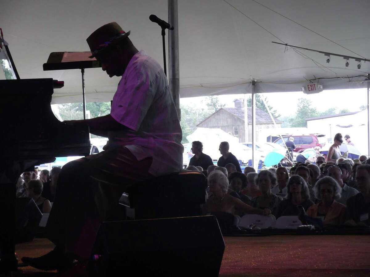 RICKY CAMPBELL/ Register Citizen Pianist Onaje Allan Gumbs pounds at the keys Saturday during the Litchfield Jazz Festival. Gumbs, a member of the Sojourner Truth Project with Avery Sharpe, took his turn during the group's opening composition entitled "Isabella's Awakening", a salute to abolitionist and women's rights activist Sojourner Truth.
