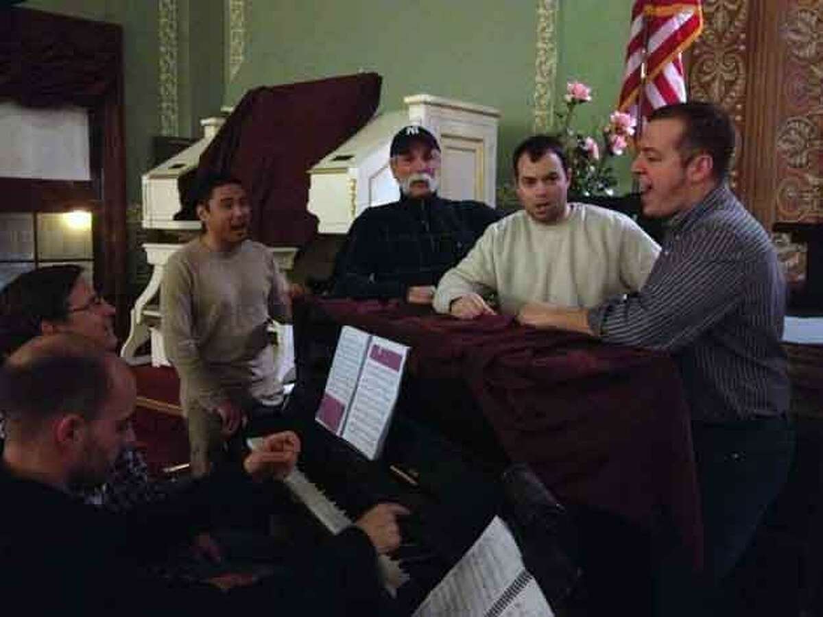 Photo provided by Lynn D'Ambrosi Above, John Dressel - accompianist, and Meric Martin, Musical Director, rehearse with the Quartet from left to right Richard Damaso, Steve Sorriero, Tyson Chamberlin, and Ryan Fitzpatrick. Below, Chuck Stango as Harold Hill serenades Sybil Chamberlin as Marian Paroo. The photos were taken during Wednesday night's rehearsals for "the Music Man" which continues this weekend at the Thomaston Opera House.